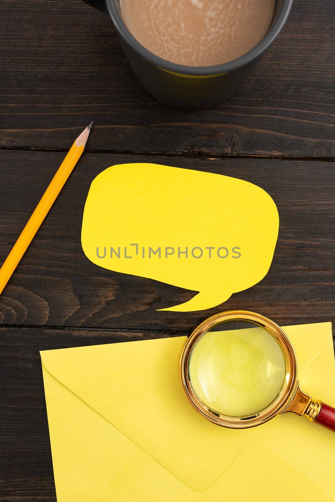 Thought Bubble Paper With Envelope, Coffee Cup And Stationery On Wooden Background. Business Strategies With Drink On Table. It Is Showing Crucial And Important News. by nialowwa