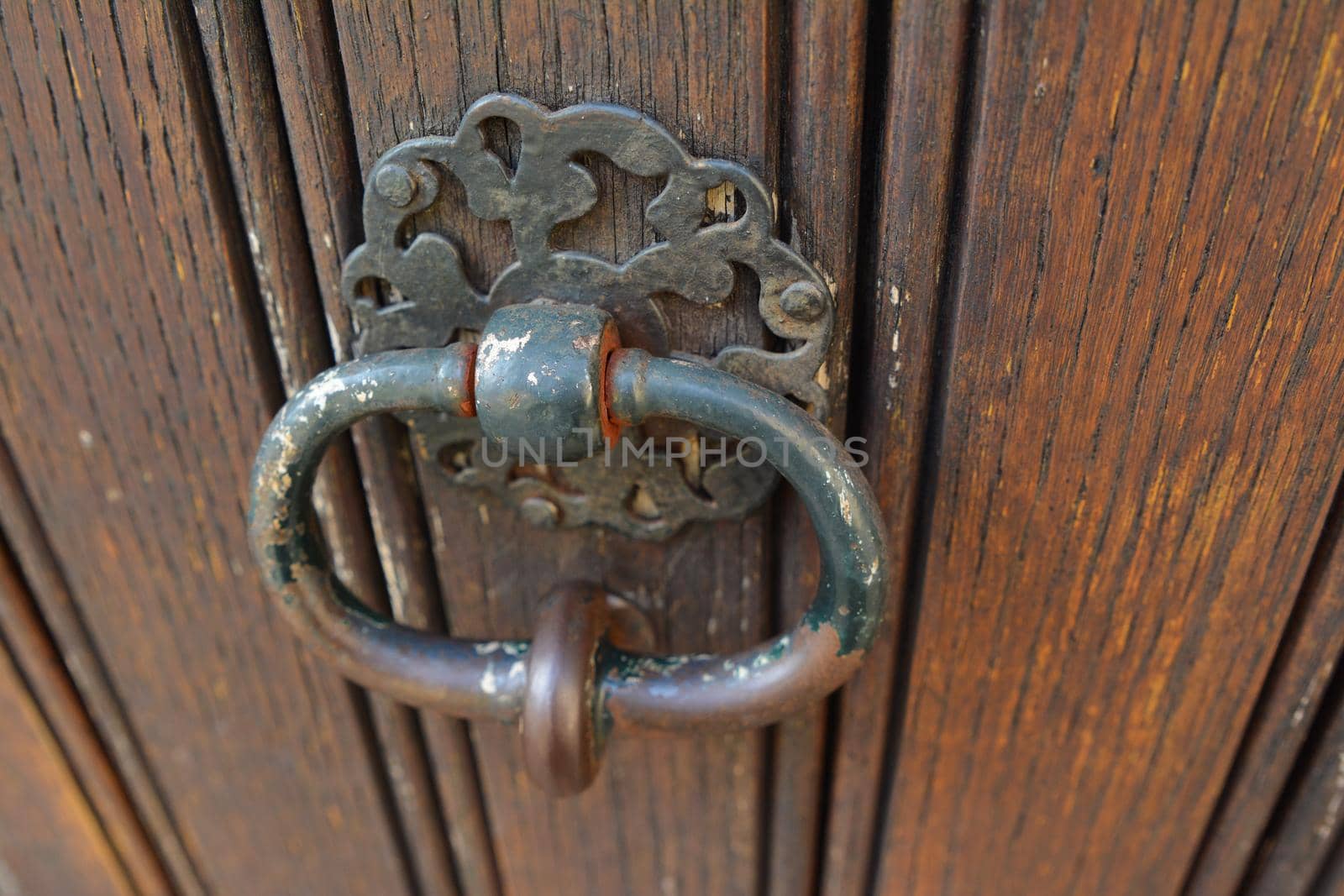 handle door rusty iron ring in wood doorway