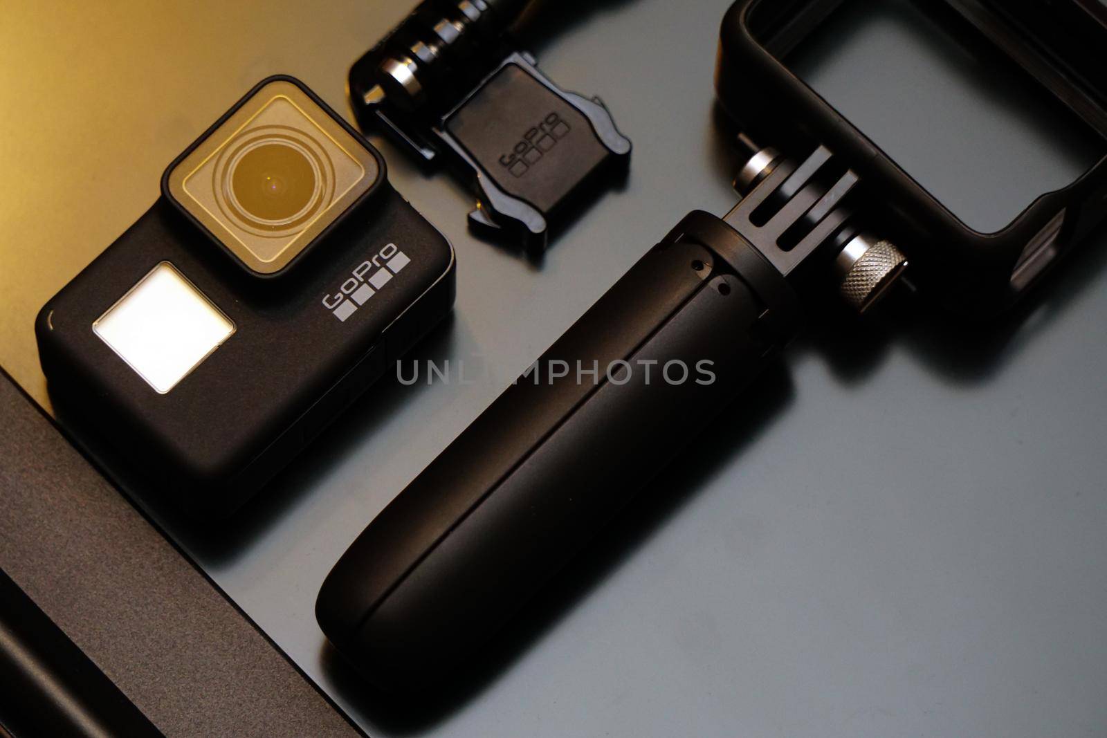 16 May 2019 Eskisehir, Turkey. Gopro 7 black assorted accessories and laptop on wooden background