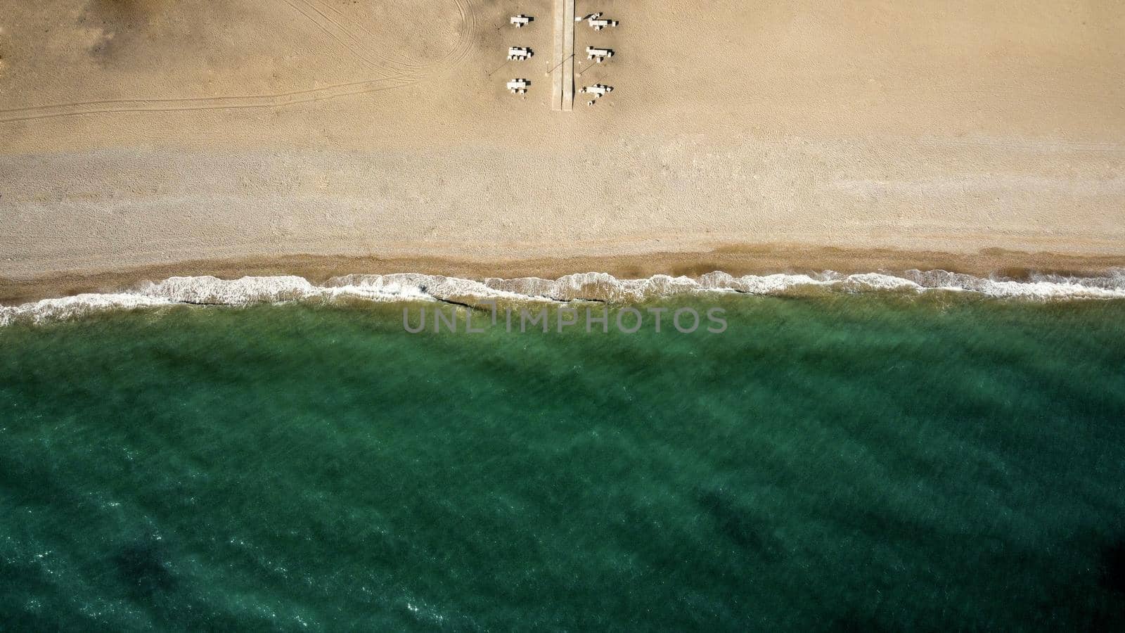 Empty beach coastline in the autumn aerial drone view