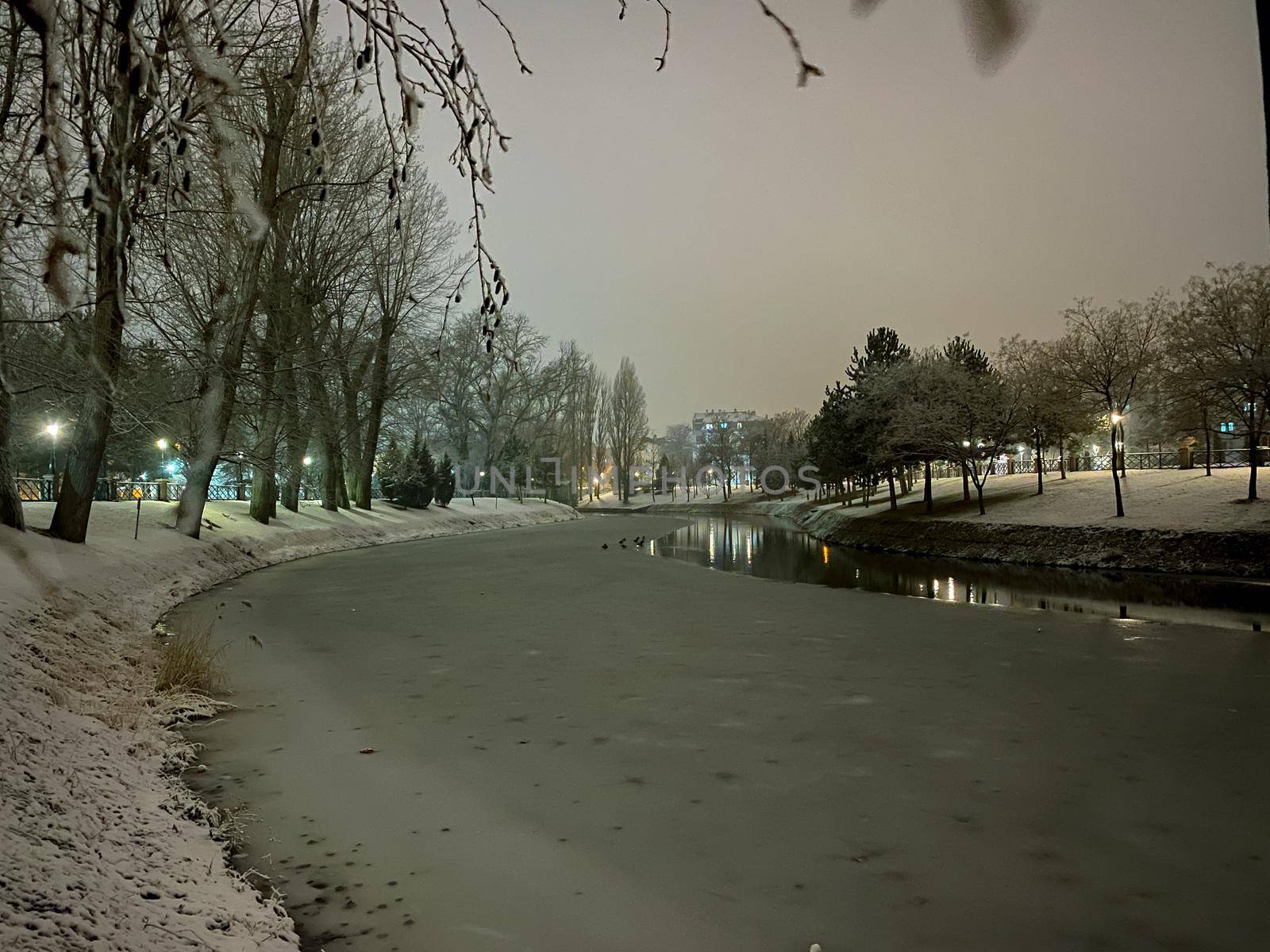 Frozen Porsuk river in Eskisehir at Kanlikavak park at night snow scenes