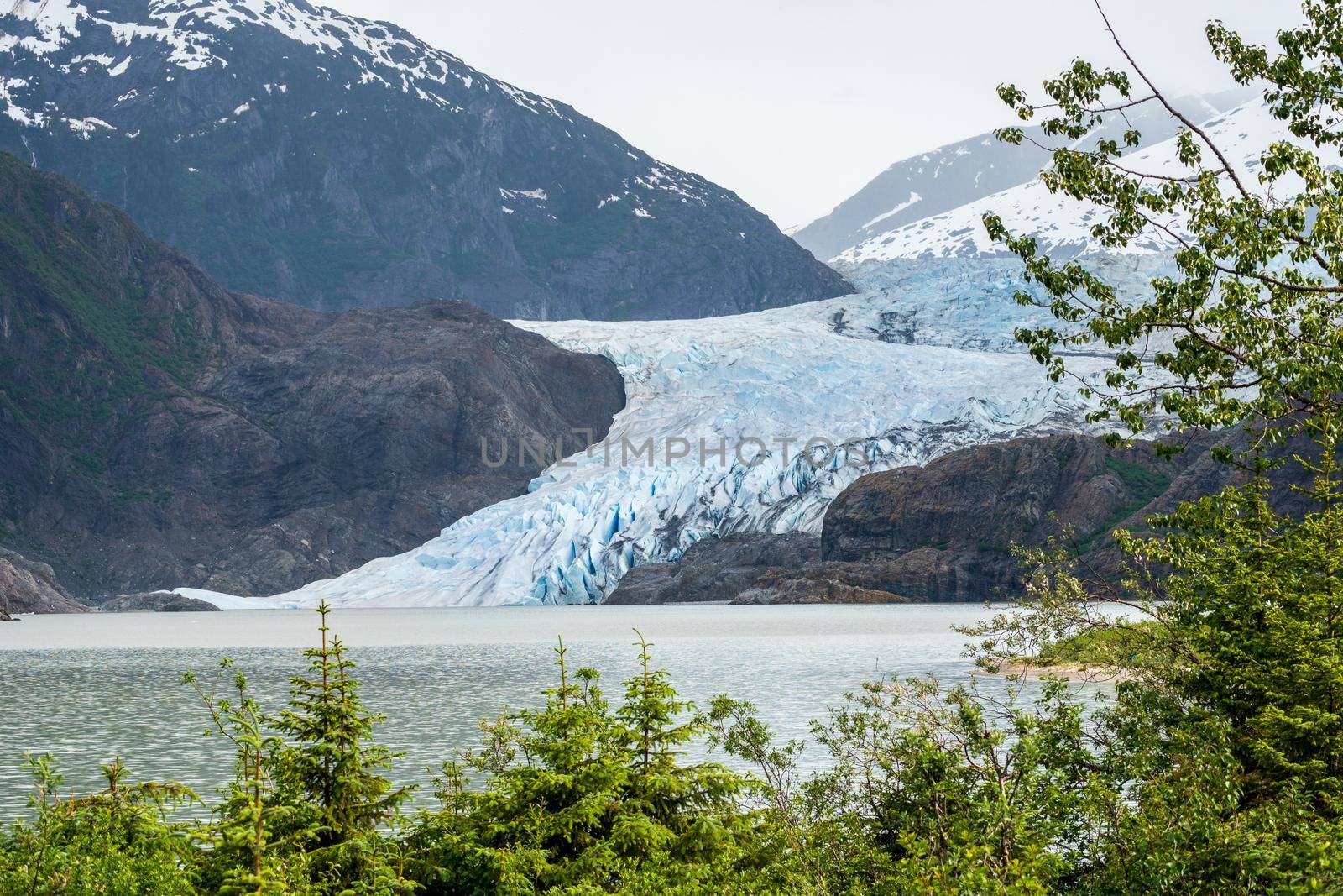 Close up of crevasses on the Mendenhall Glacier as it enters lake close to Juneau in Alaska