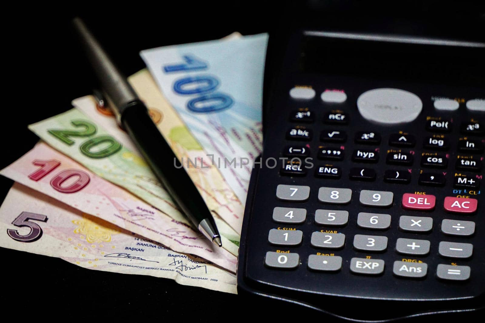 Turkish lira banknotes calculator bills and tax calculations on isolated background