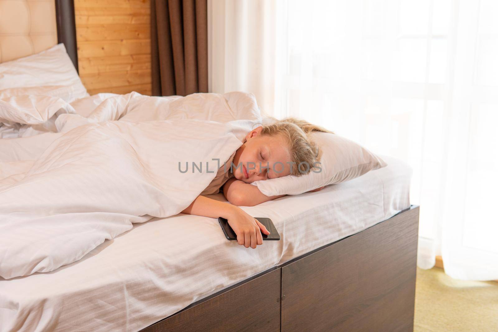 Sleep phone mobile beautiful young girl bed blanket sleeping lying, concept female relax for person for nap bedding, healthy relaxation. Indoors cozy pleasure,