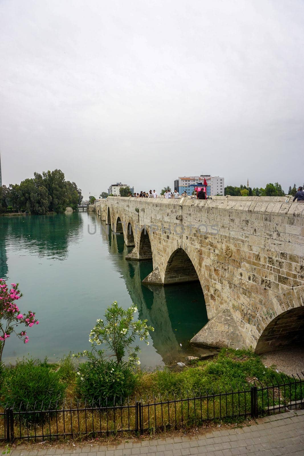 14 May 2022 Adana Turkey. Rock bridge on Seyhan River at Adana Turkey on a cloudy day