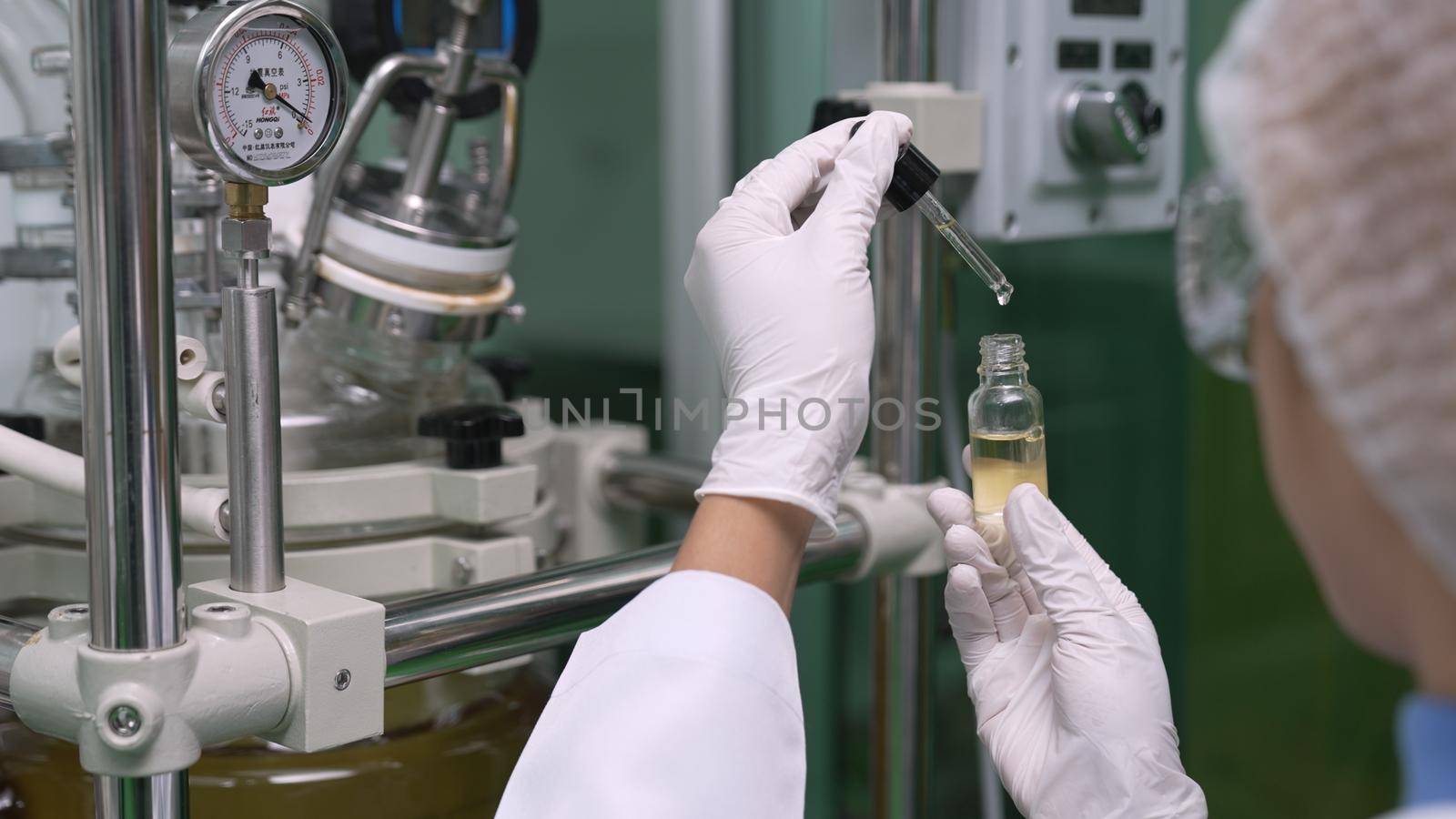 Scientist test CBD hemp oil product in curative CBD lab . The hemp oil contain natural cbd extraction from organic hemp in the farm .
