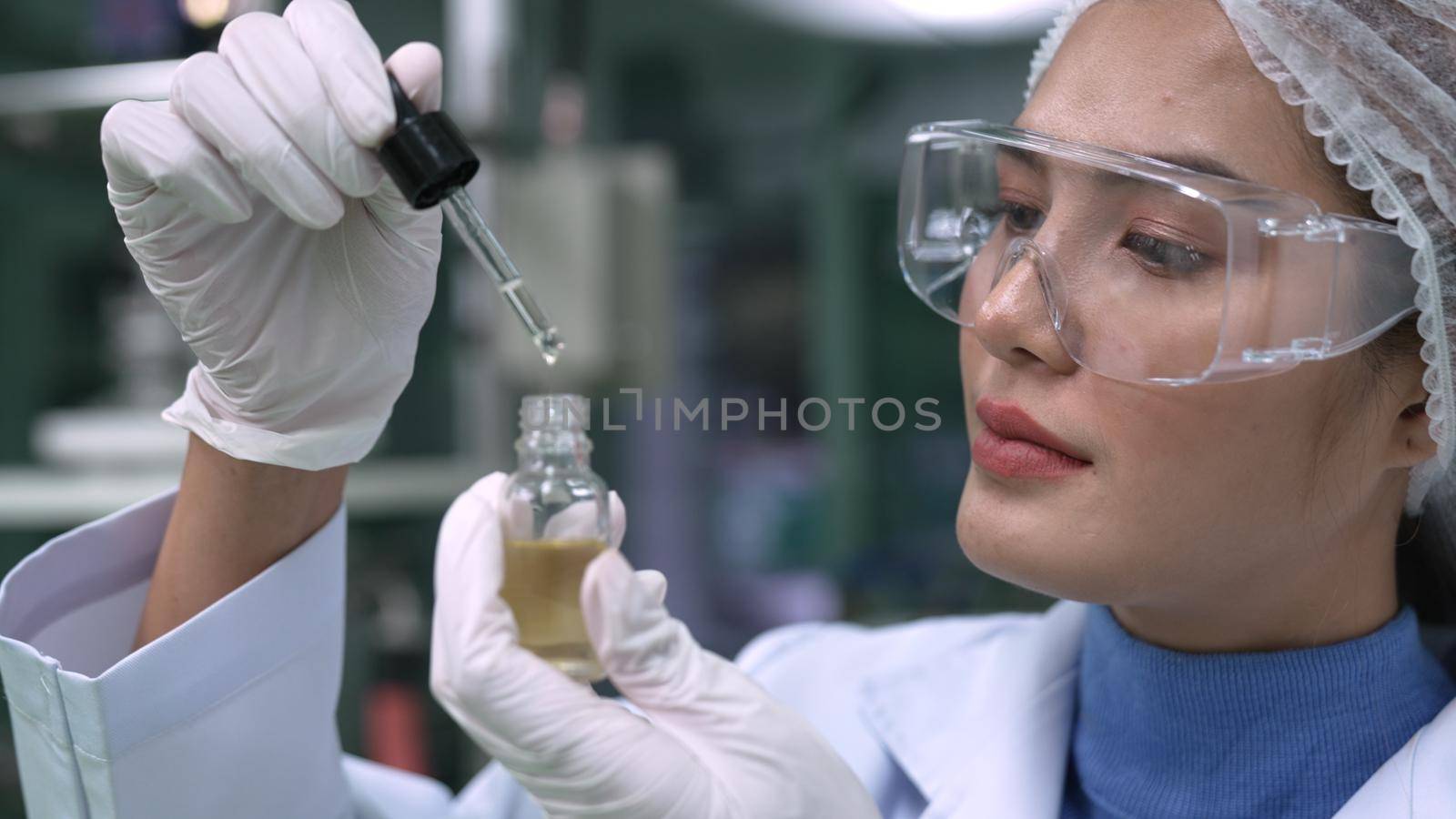 Scientist test CBD hemp oil product in curative CBD lab . The hemp oil contain natural cbd extraction from organic hemp in the farm .