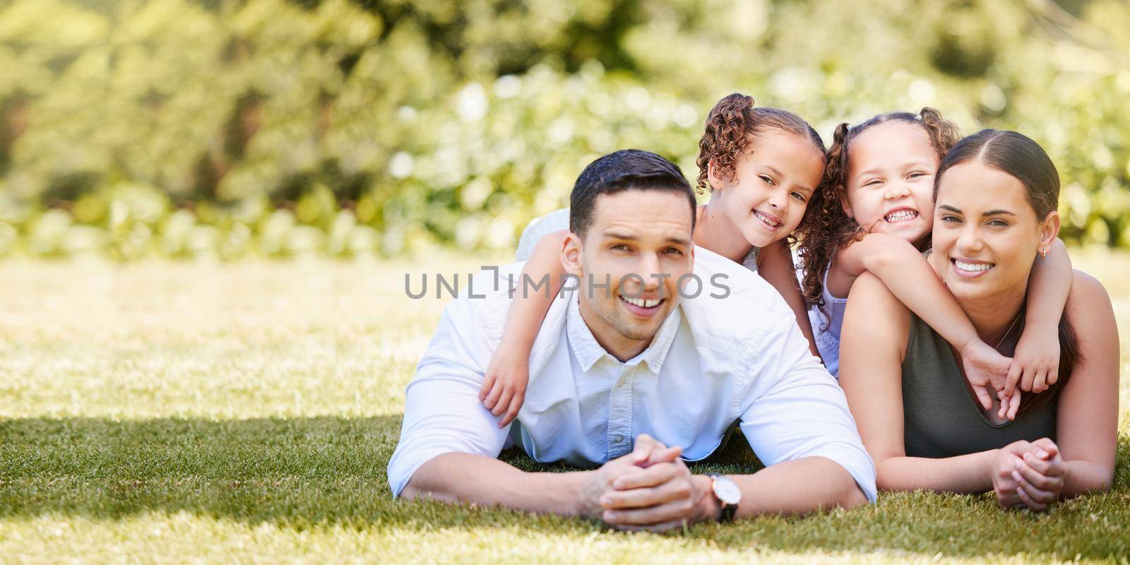 Todays moments make tomorrows memories. Portrait of a happy young family enjoying a fun day out at the park