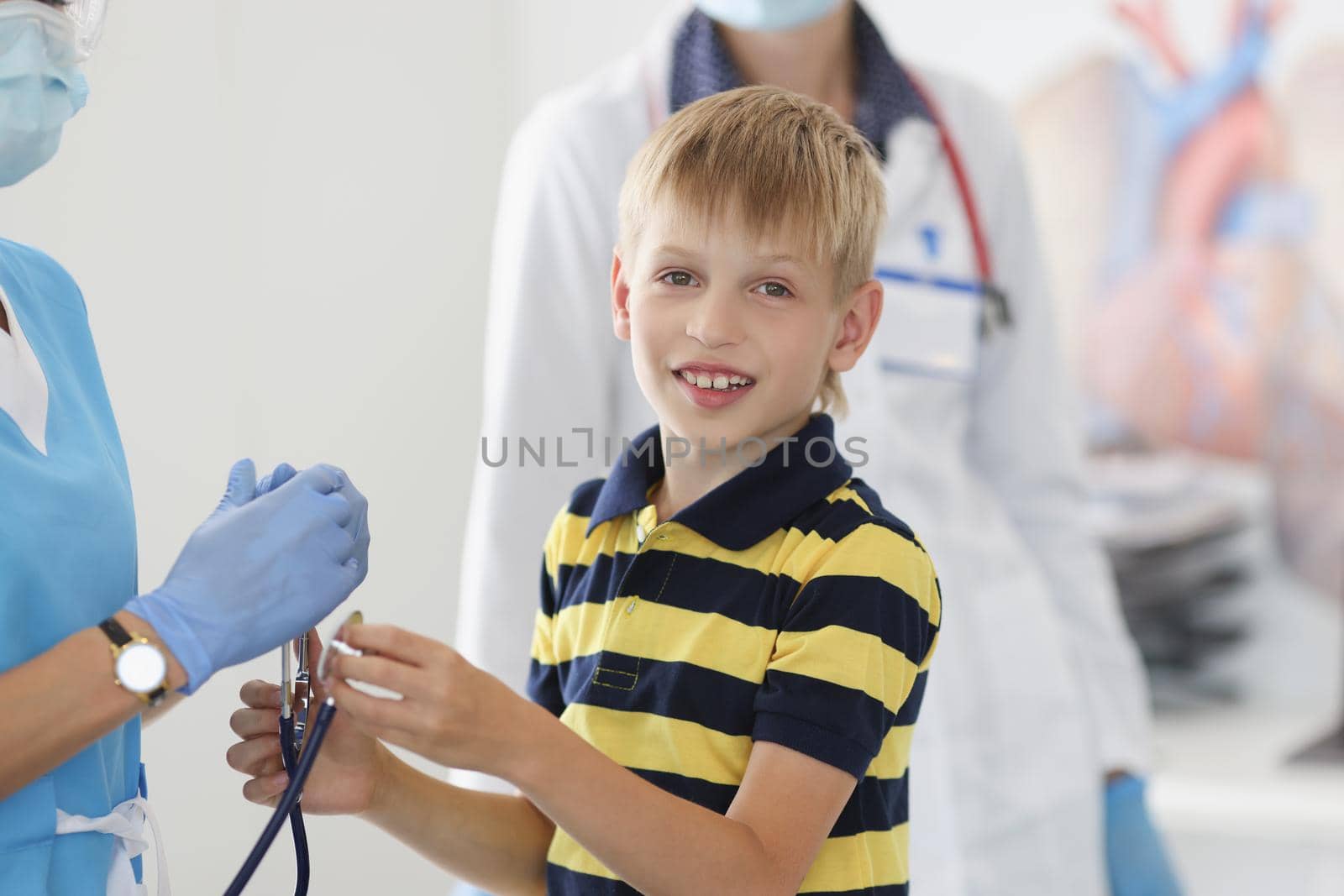 Portrait of boy kid on appointment in clinic, pediatrician going to examine health condition of kid. Health childhood, checkup, medicine, analysis concept