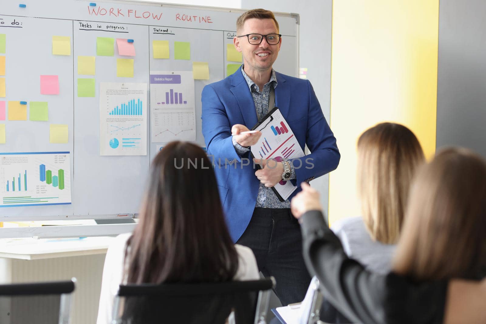 Portrait of enthusiastic businessman share future company goals, board with tasks, conference meeting. Business, strategy, teamwork, training, aim concept