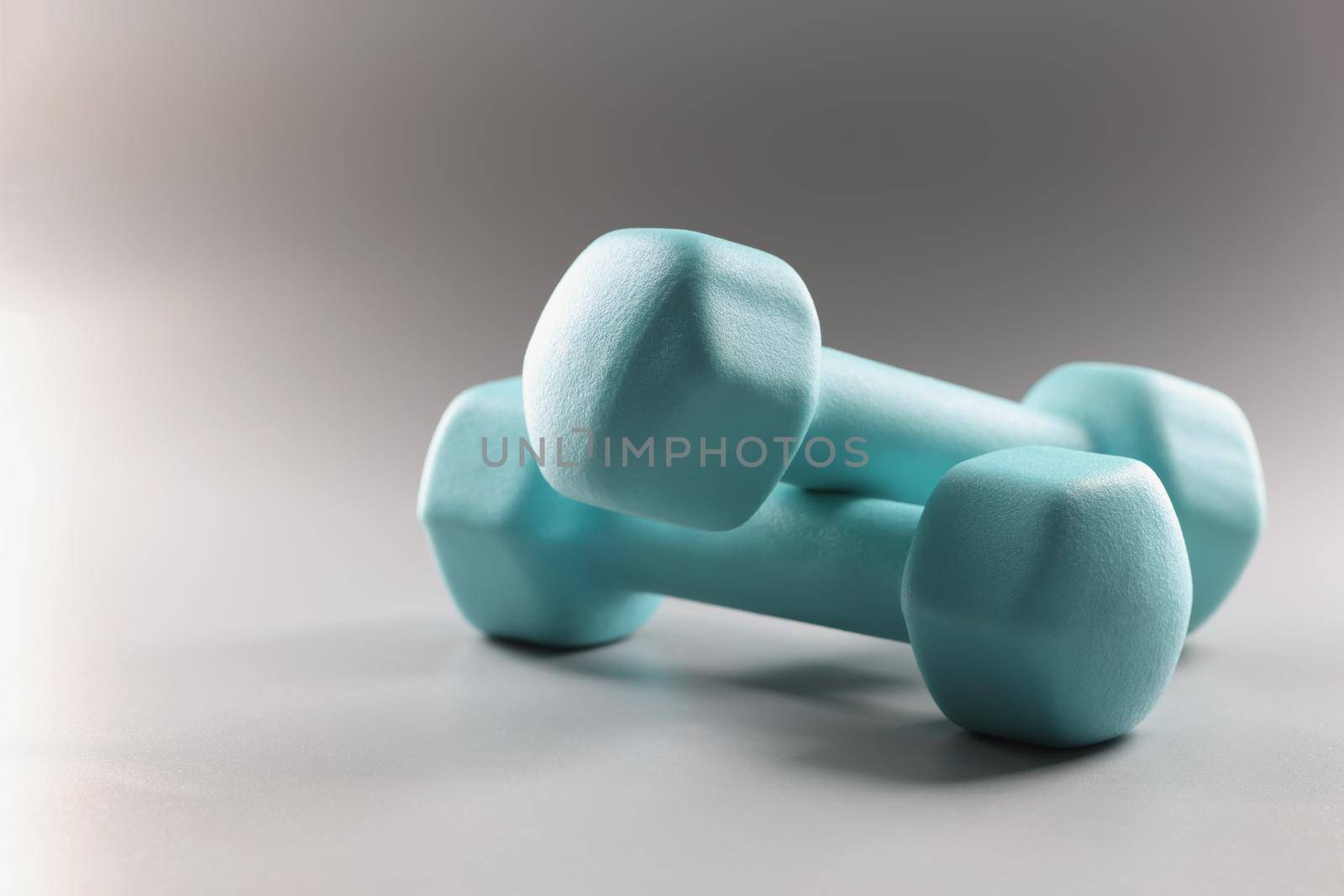 Close-up of pair of blue dumbbells, equipment weight loss, sport activity, physical exercise. Sport, health, physical activity, habit, goal, gym concept
