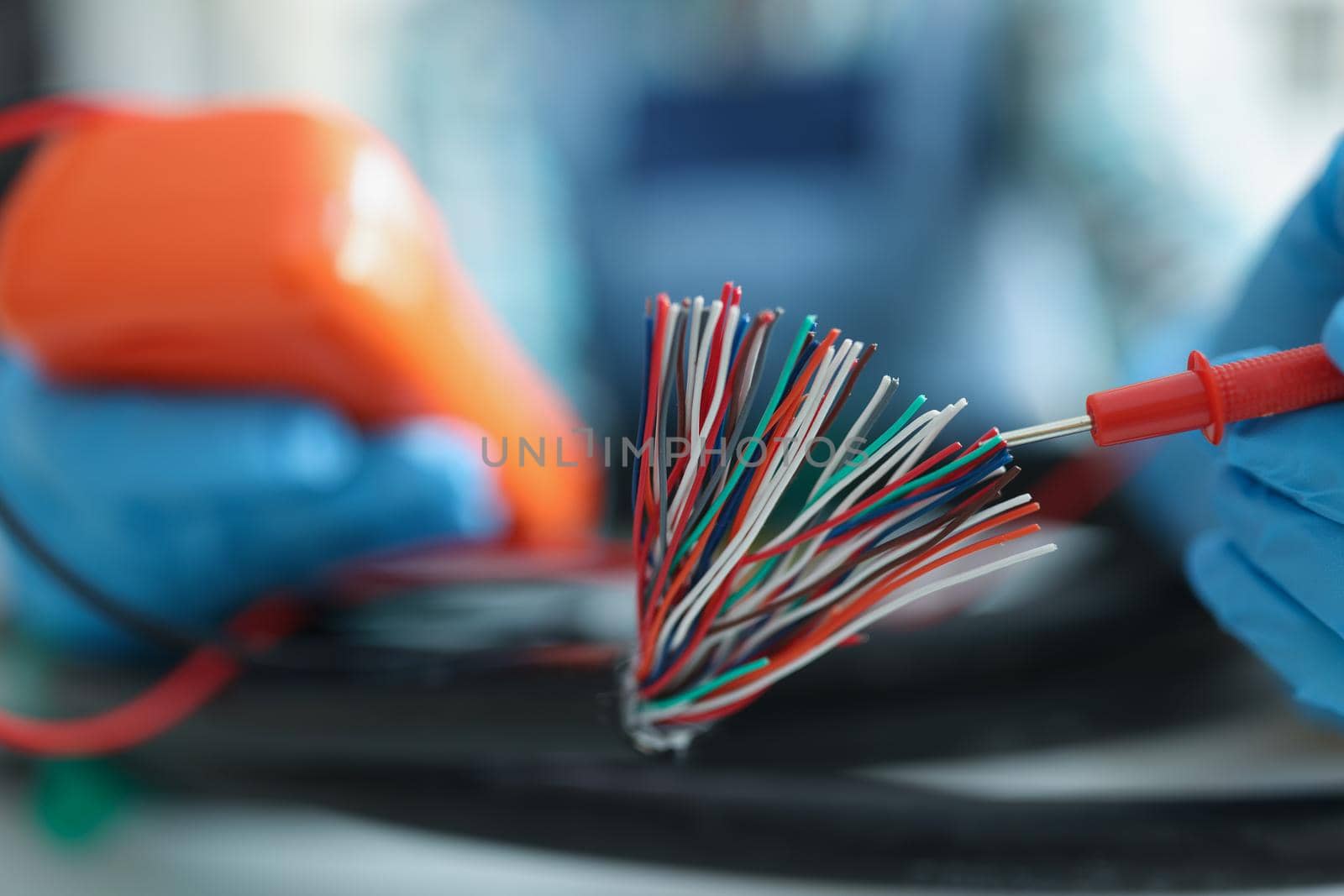 Close-up of man measuring voltage with special equipment, tool for checking pressure, bunch of wires. Electronic instrument for work. Fix, repair concept