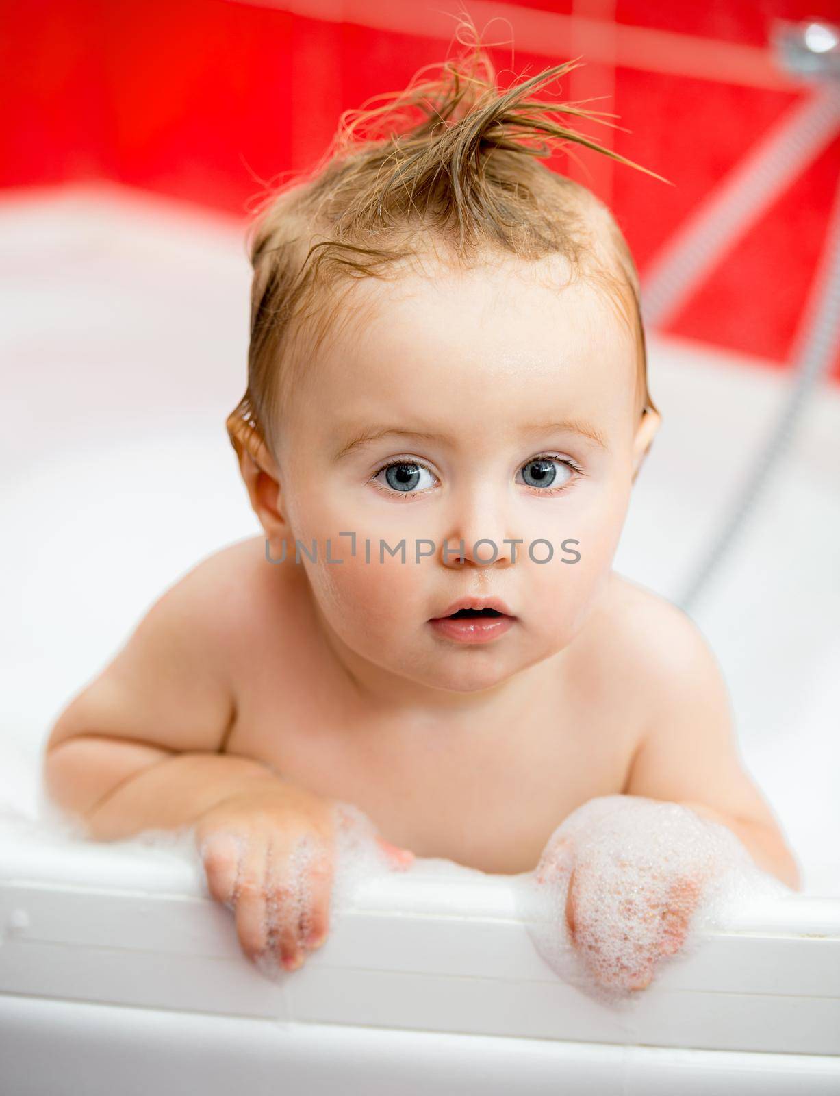 cute little baby taking a bath