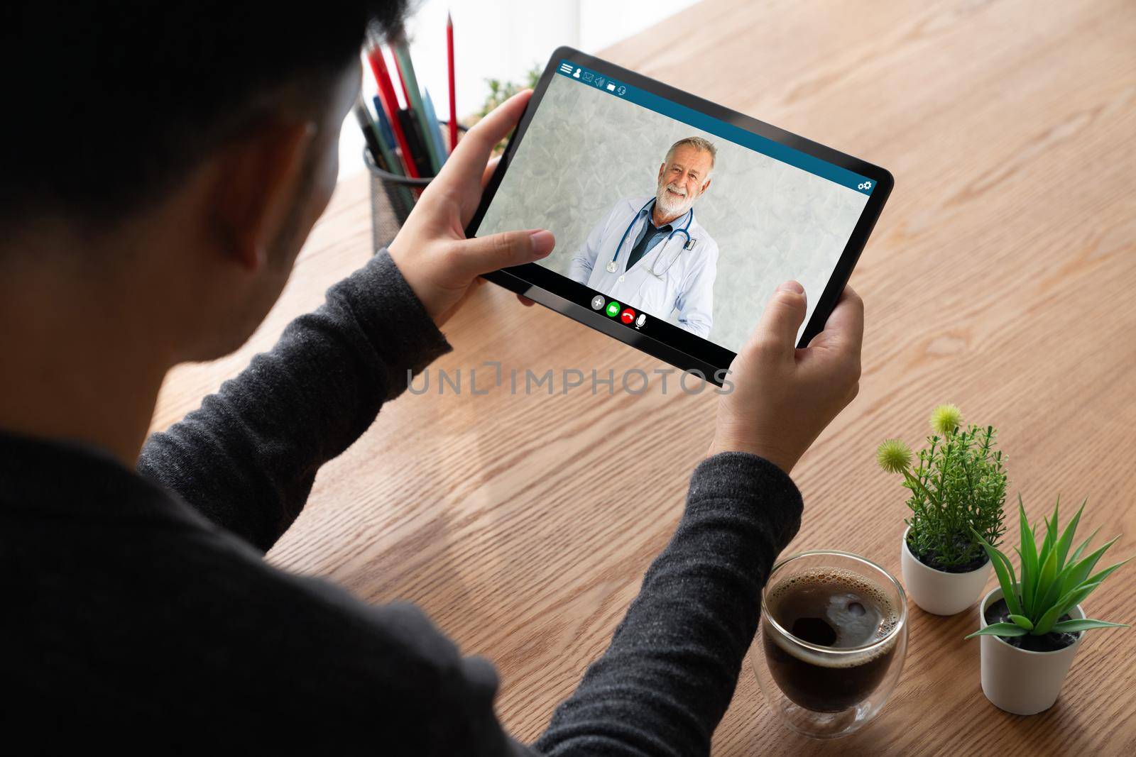 Doctor video call online by modish telemedicine software application for virtual meeting with patient