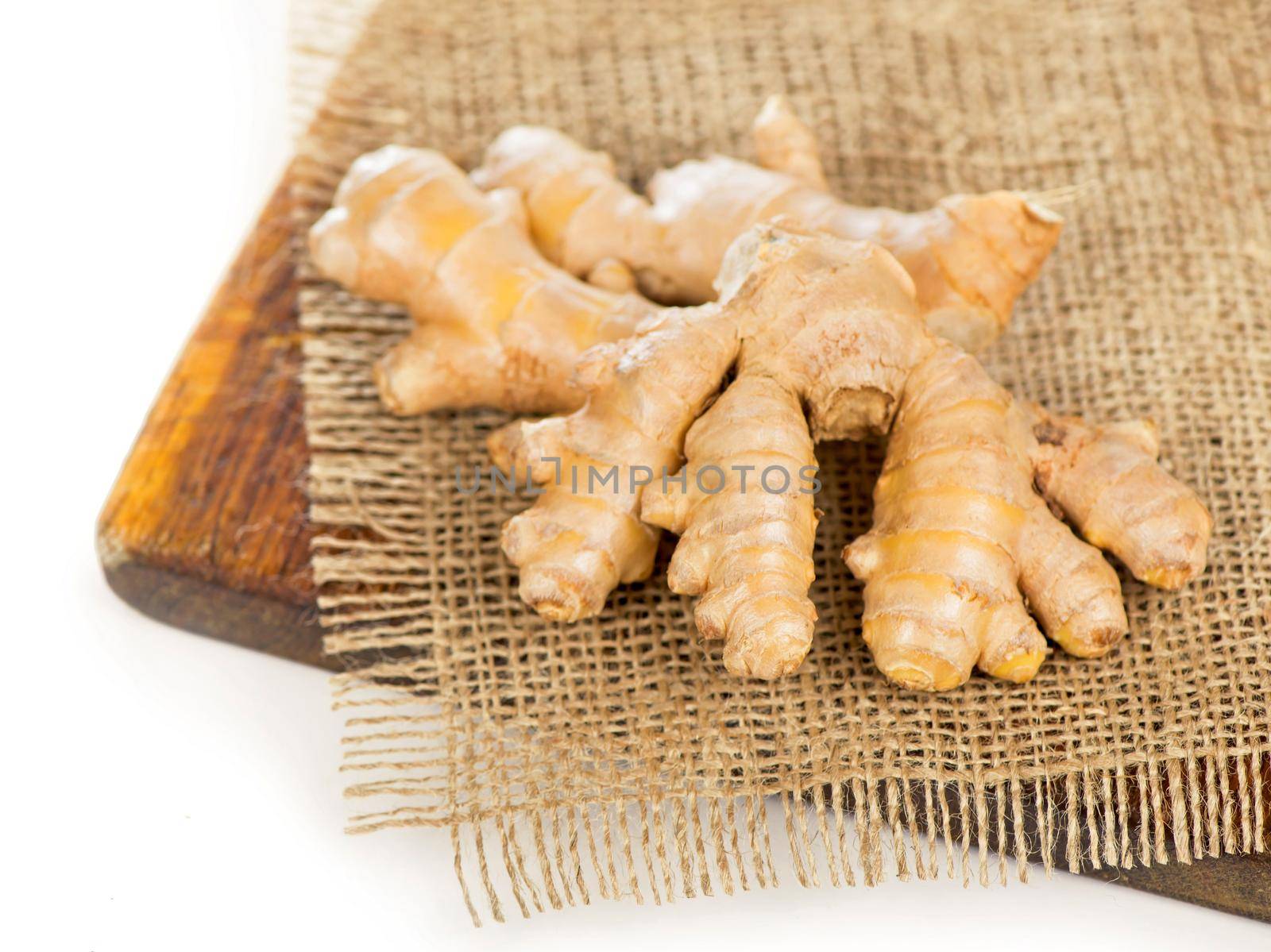 spice and condiment. Ginger root on dark wooden background top view by aprilphoto