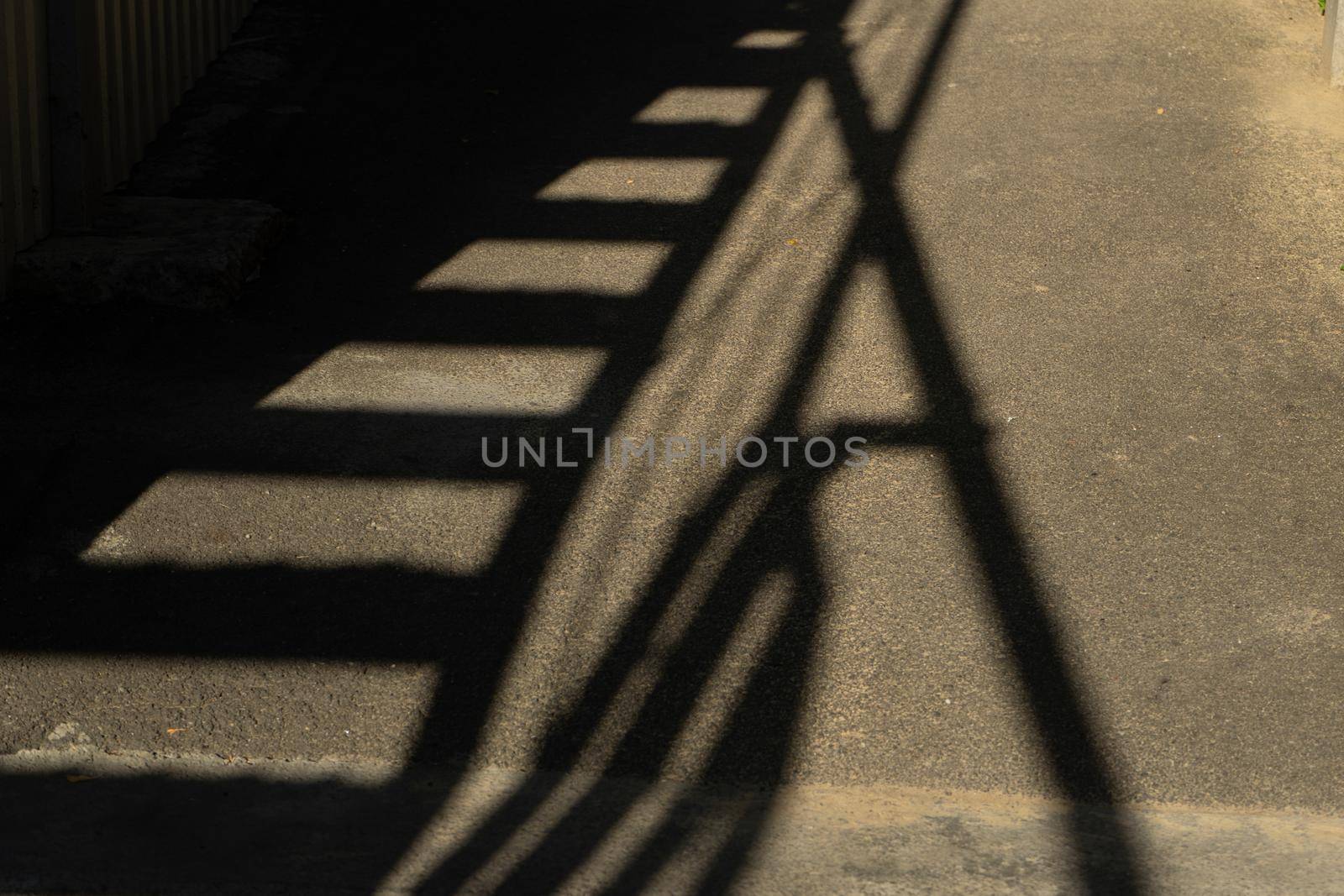 Shadow on the asphalt from an industrial building by Serhii_Voroshchuk