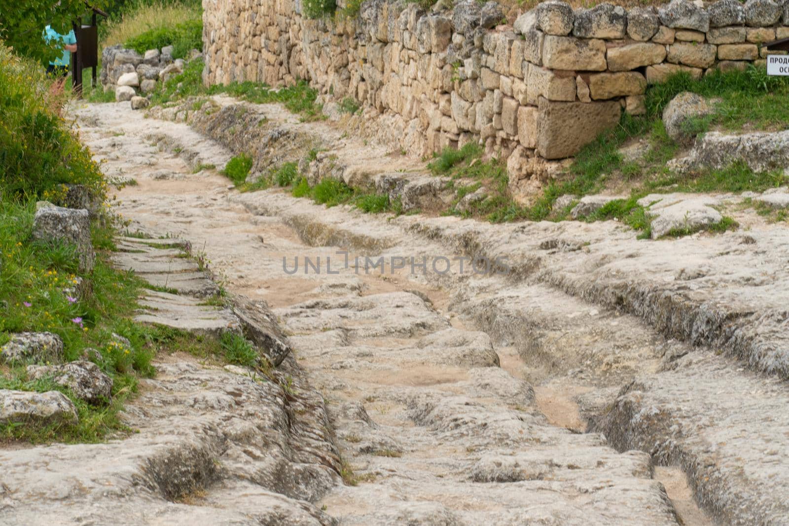 Ancient chufut road bakhchisaray city cave crimea medieval street monument, concept landscape building from architecture from russia tree, autumn landmark. View scene stony,