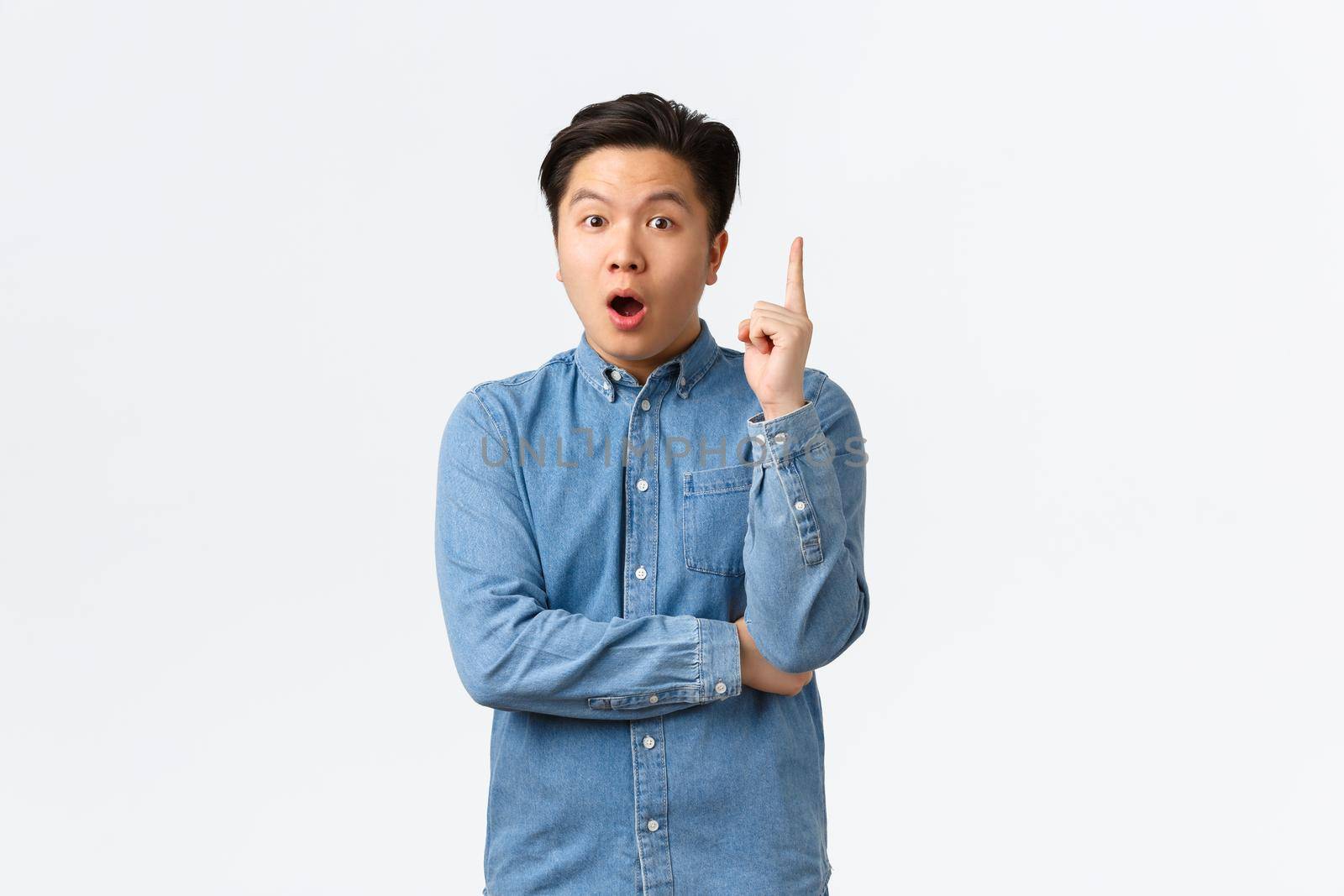 Excited smart and creative asian man in shirt having idea. Guy making suggestion, think-up great plan, raising index finger in eureka gesture, saying his opinion, standing white background by Benzoix