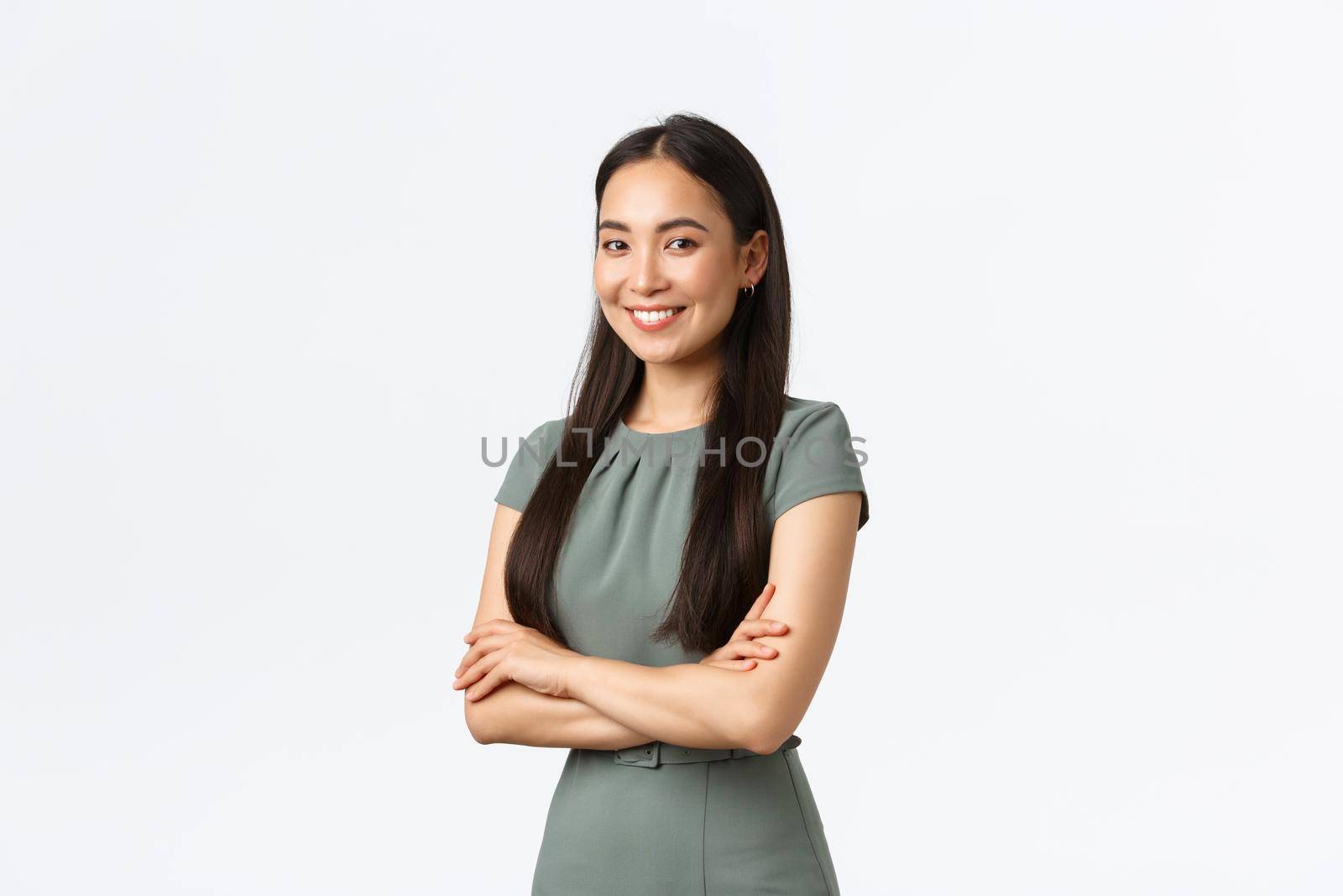 Small business owners, women entrepreneurs concept. Successful confident asian businesswoman in dress, cross arms and looking pleased at camera, smiling, managing store or internet site by Benzoix