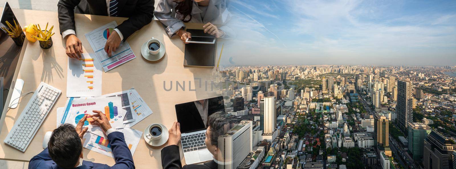 Business people group meeting shot from top widen view in office . Profession businesswomen, businessmen and office workers working in team conference with project planning document on meeting table .