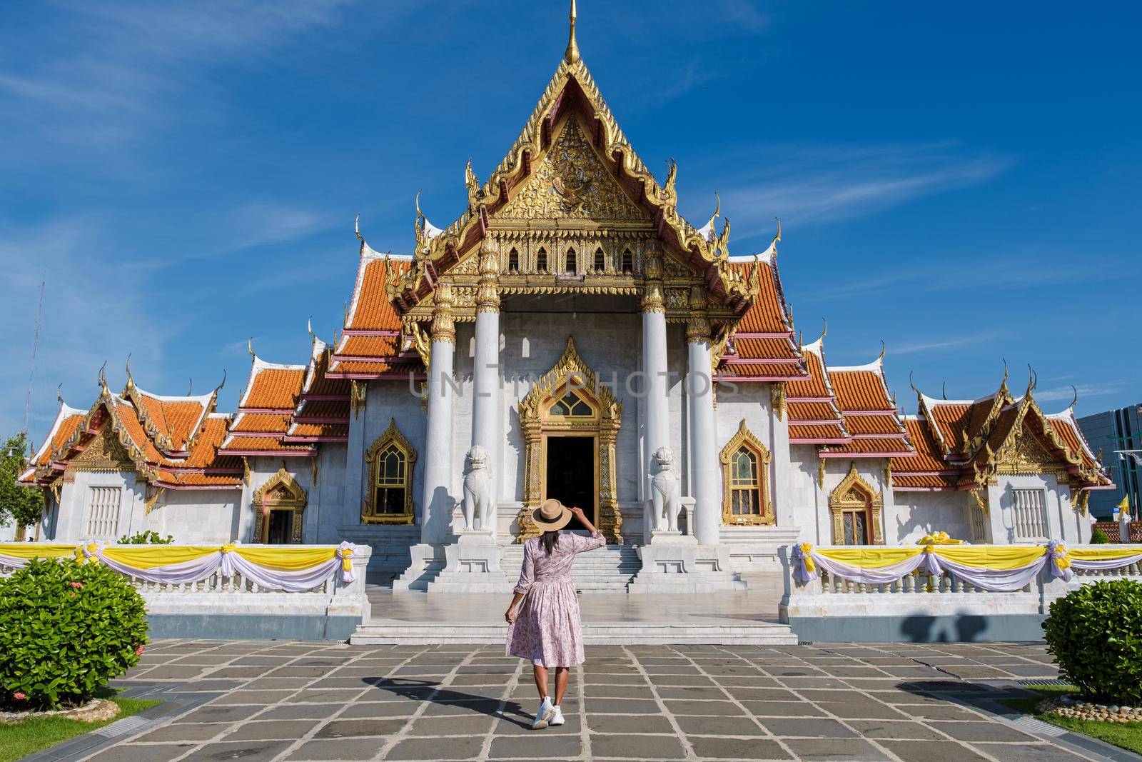 Wat Benchamabophit temple in Bangkok Thailand, The Marble temple in Bangkok. Asian woman with hat visiting temple in Bangkok