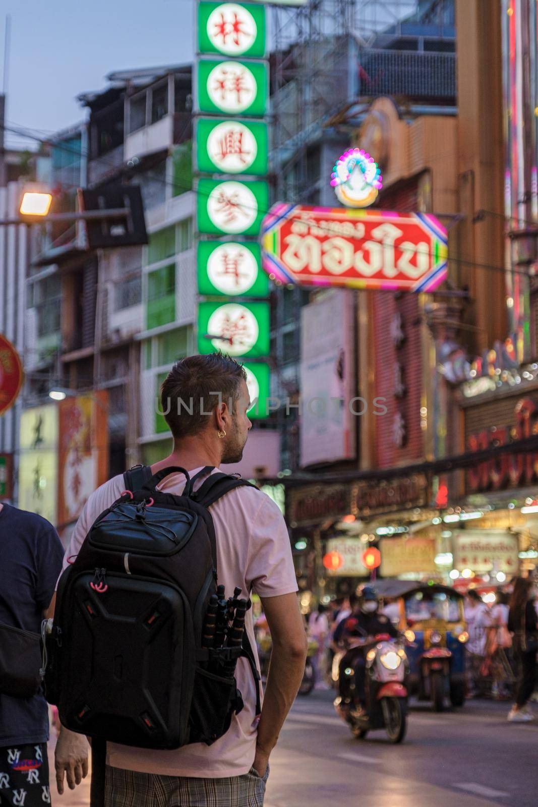 China town Bangkok Thailand, colorful streets of China Town Bangkok.European men with bag, tourist visiting Chinatown