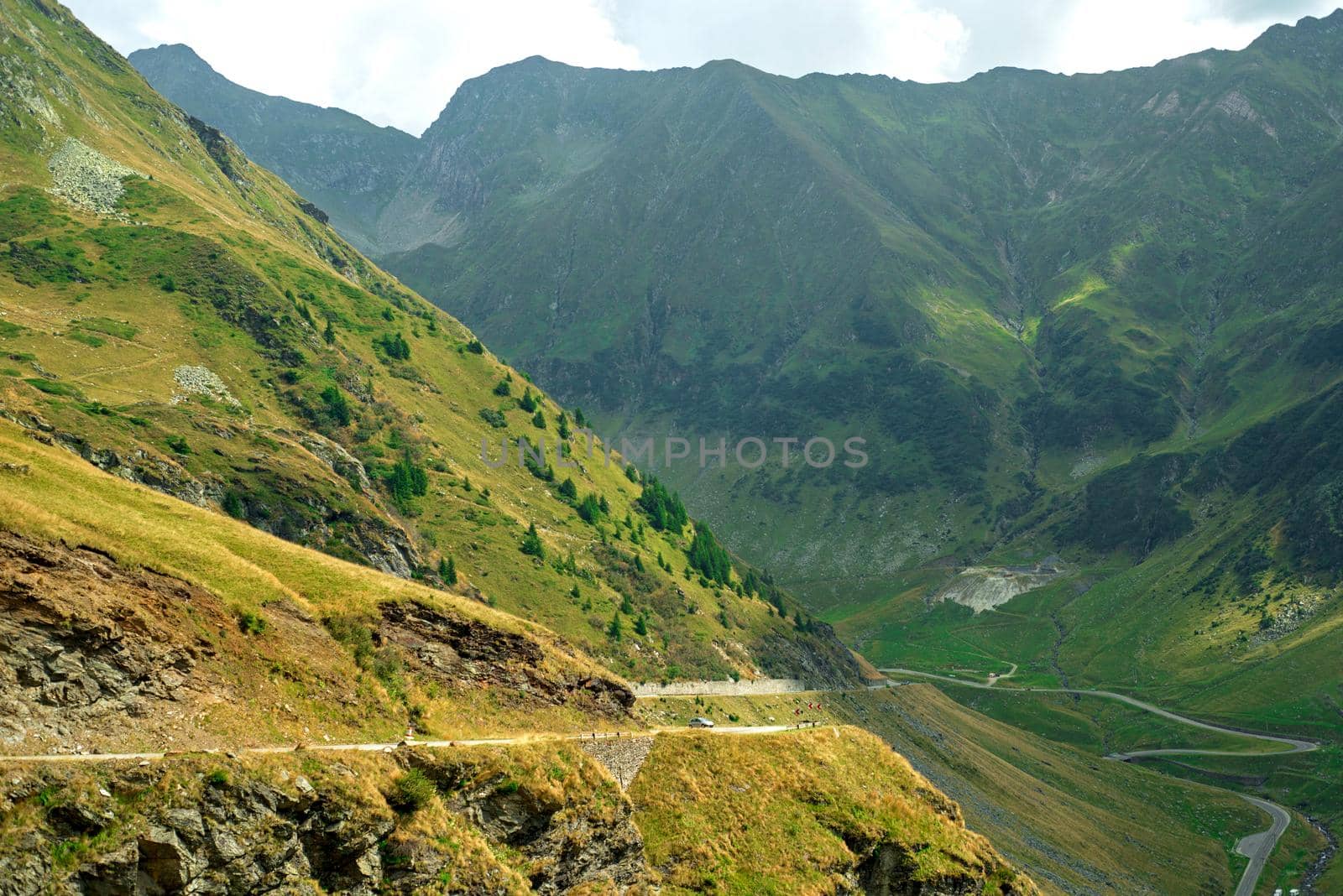 Beautiful landscape of high green mountains and turns of Transfagarasan road, is one of the most beautiful roads in the world. Carpathians. Romania. by aprilphoto