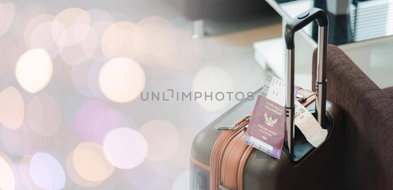 Close up Thailand passport on baggage luggage of tourist in the airport, documentation boarding pass ticket on travel suitcase pocket, Travel holiday concept