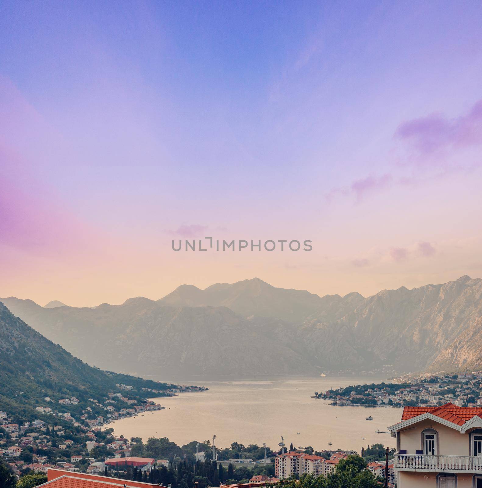 Sunset, beautiful landscape with silhouettes of trees. Travel concept. Montenegro, Kotor Bay. Sunset at Kotor Bay Montenegro. View of the sunset in Boko-Kotor Bay in Montenegro.