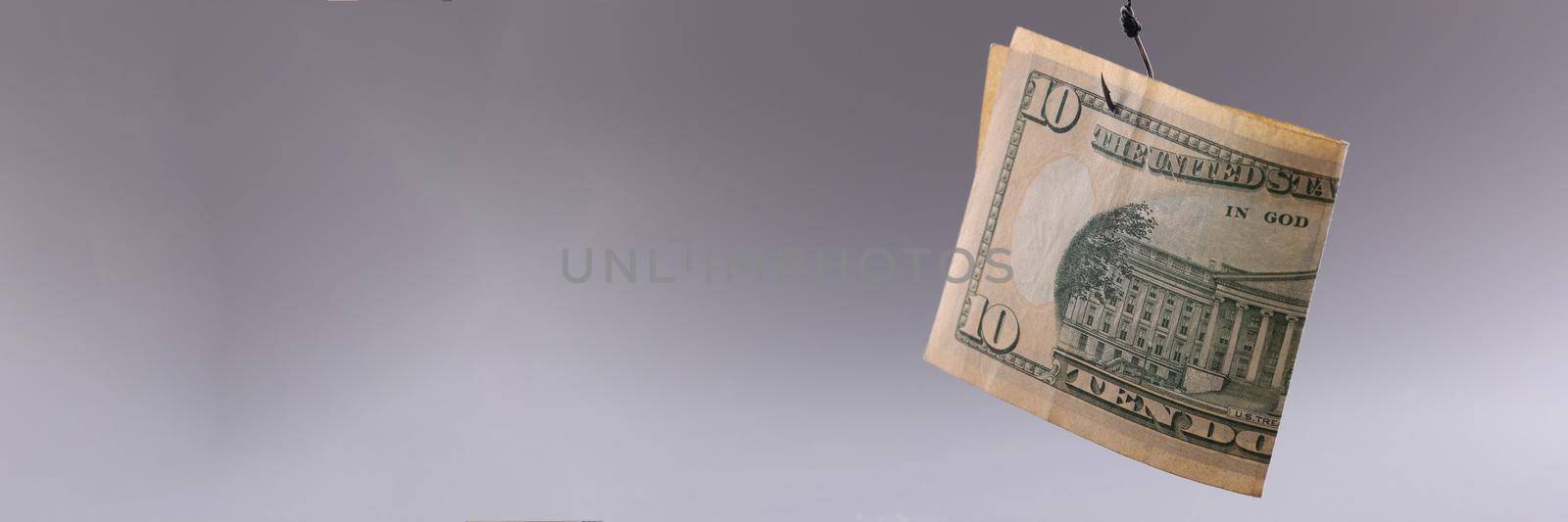 Ten dollar bill on gray background. Arnings with minimal investment concept