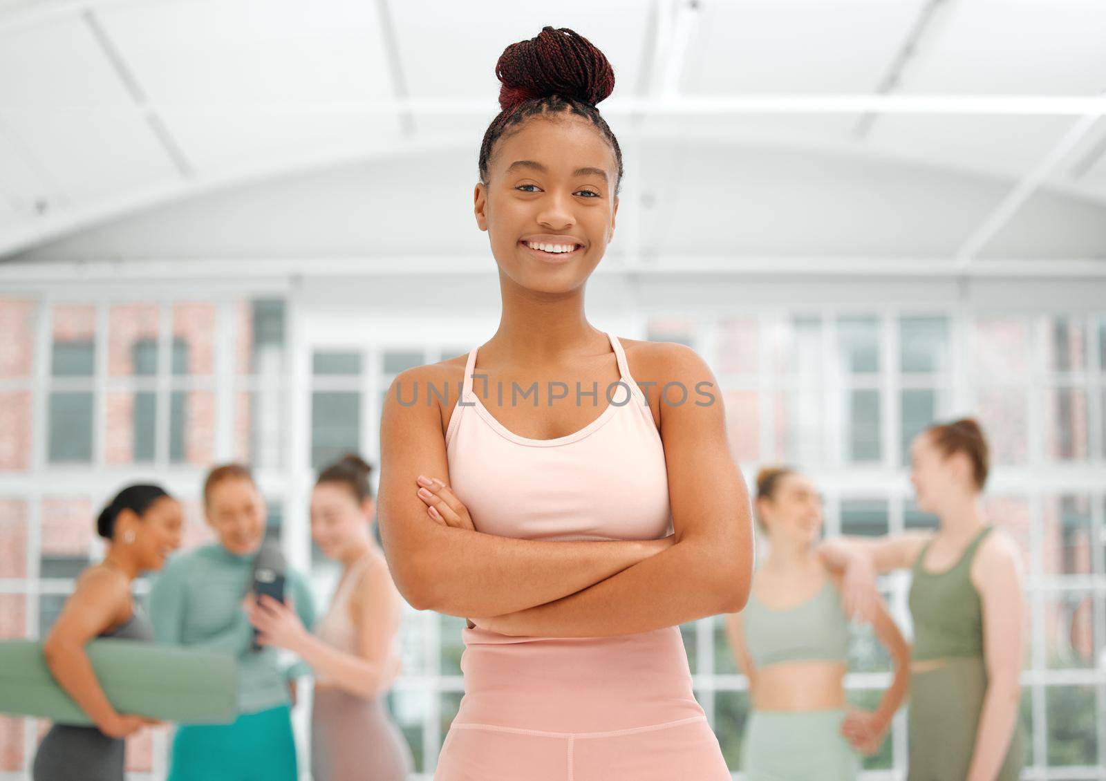 Youll feel your confidence grow when you exercise regularly. a beautiful young woman at a fitness class. by YuriArcurs