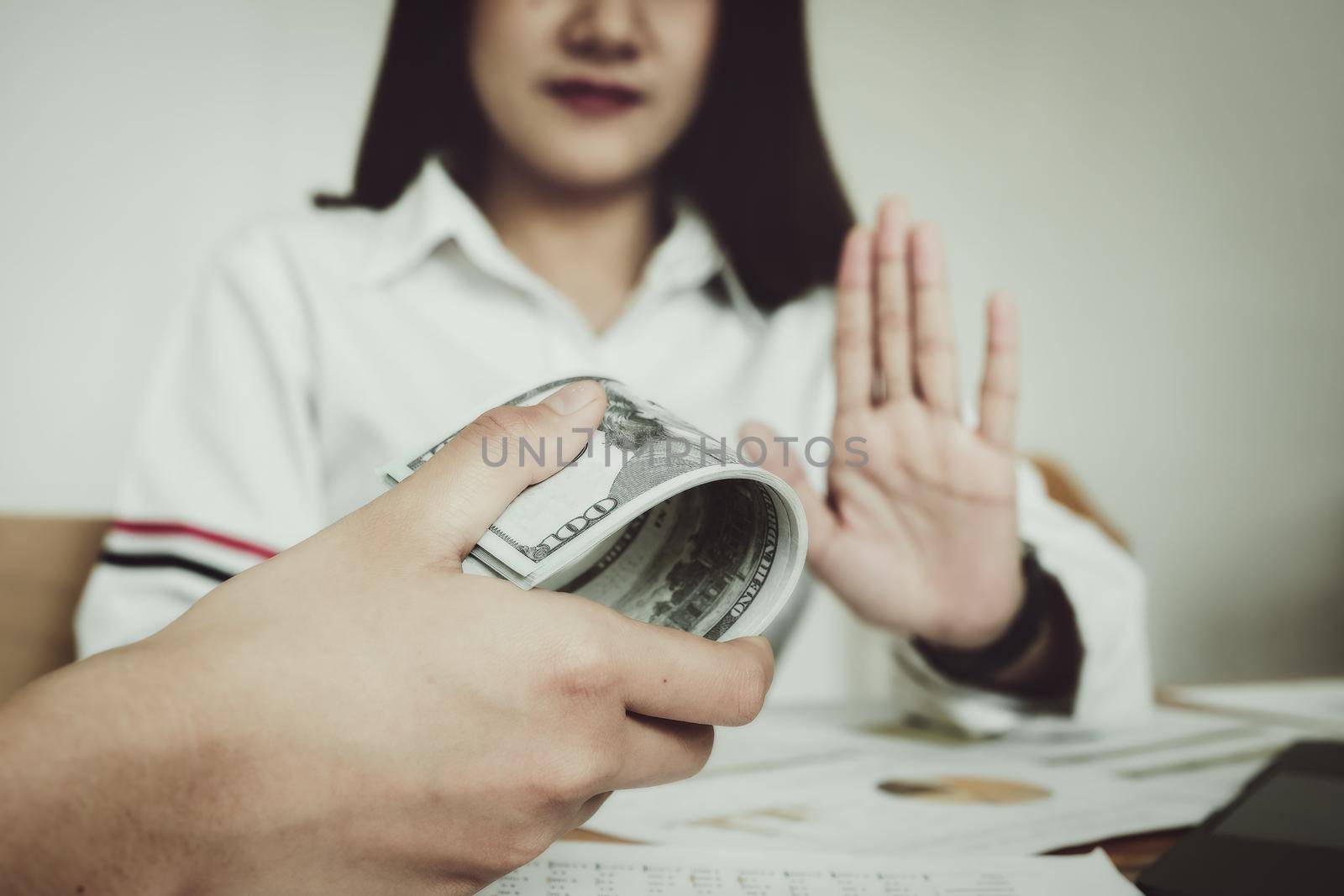 focus hand holding money, The auditor shows a gesture of refusing to receive money from the bribery of the officer