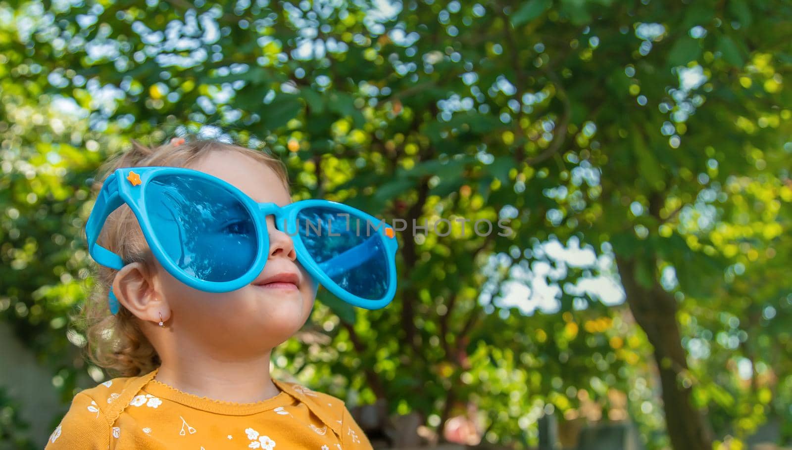 Children enjoy nature in glasses. Selective focus. Nature.