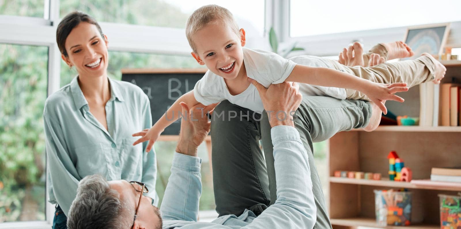 Whatever you call it, you need family. two parents playing with their son at home