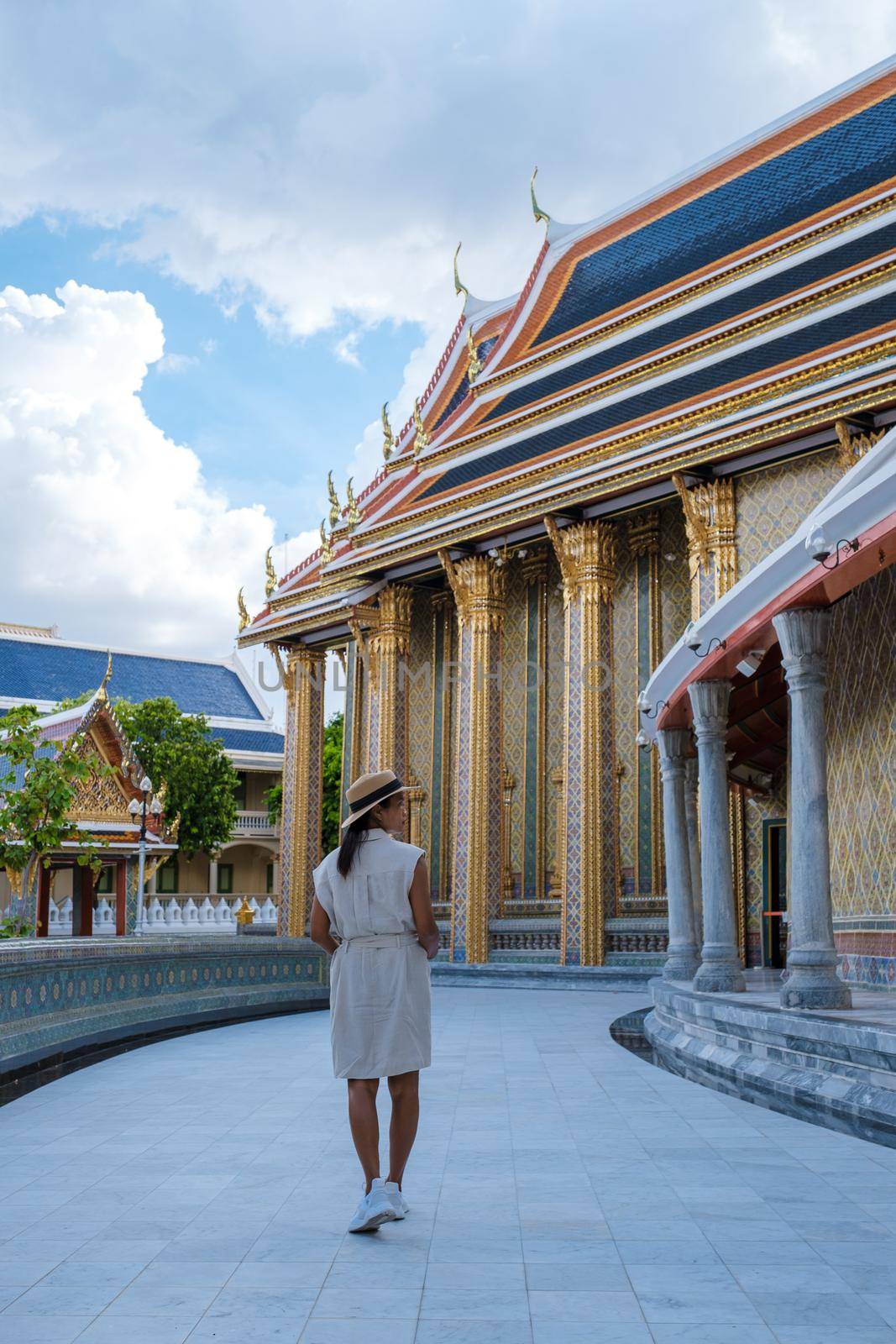 Wat Ratchabophit temple in Bangkok Thailand, beautiful temple with a golden pagoda in Bangkok. Beautiful Buddhist temple on a bright sunny day, Asian woman on a city trip in Bangkok