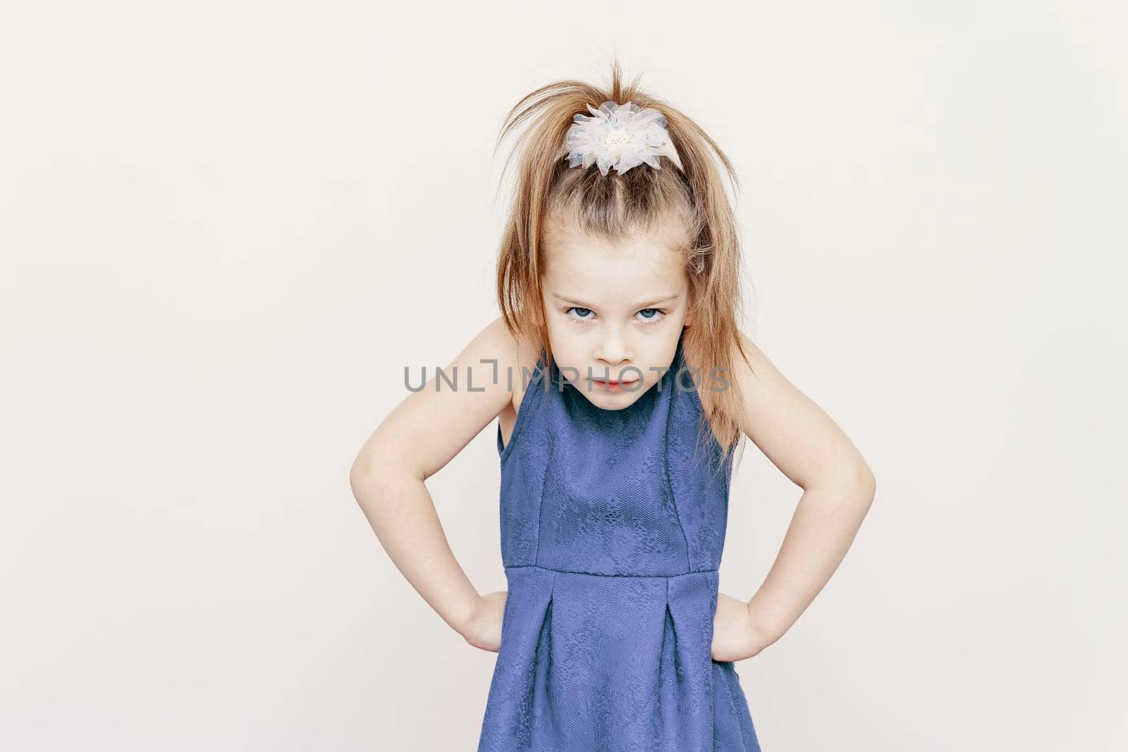 portrait of not happy little cute girl in blue dress by Lena_Ogurtsova