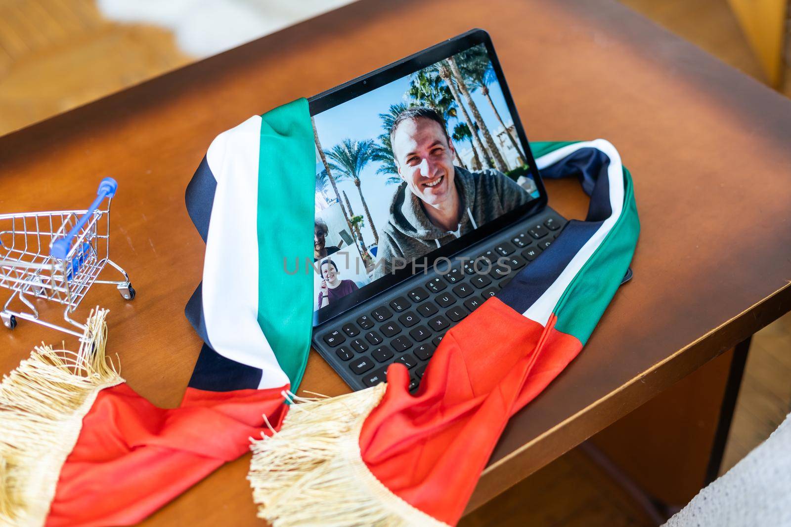 Tablet, UAE flag, toy cart.