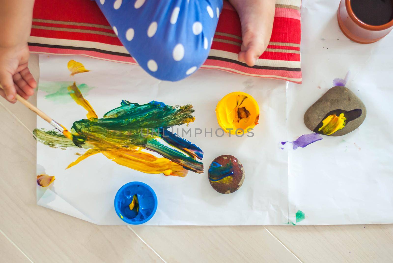 toddler paints with gouache. High quality photo