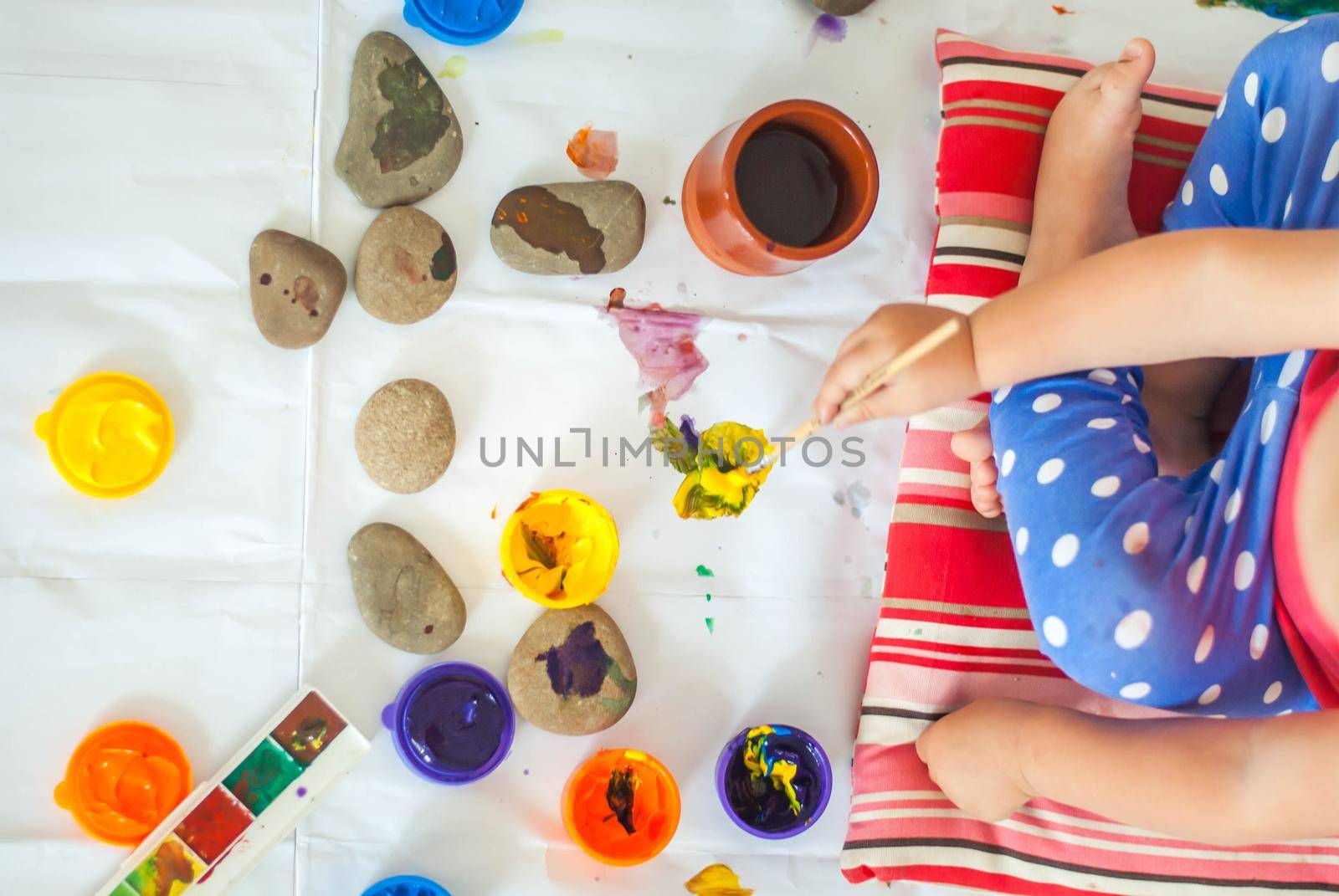 toddler paints with gouache. High quality photo