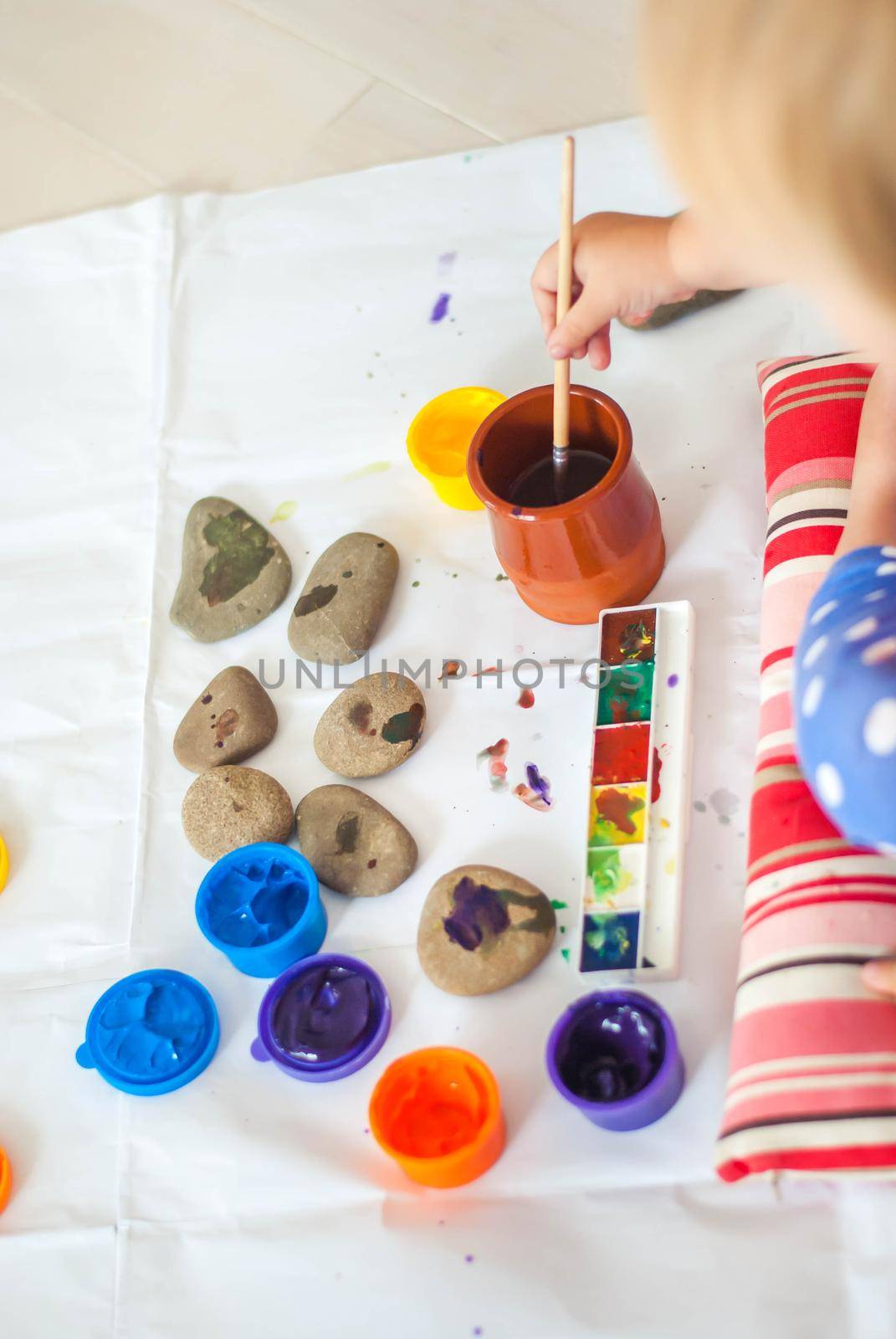 toddler paints with gouache. High quality photo