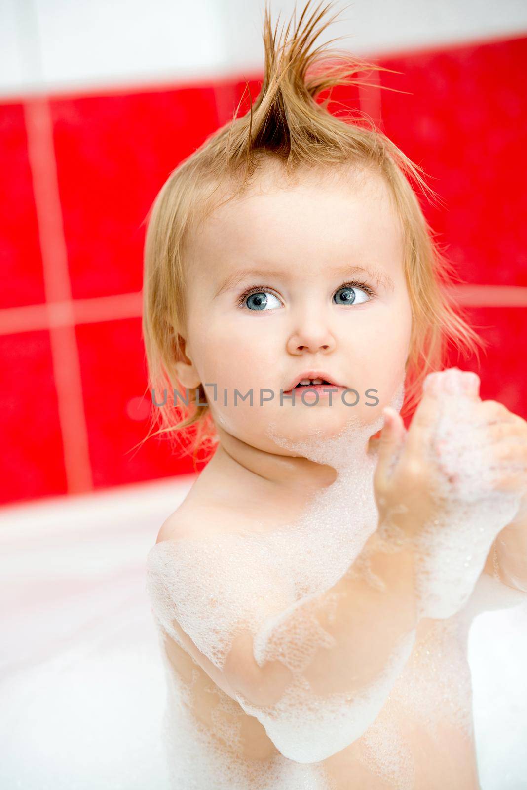 little baby in a bubble bath