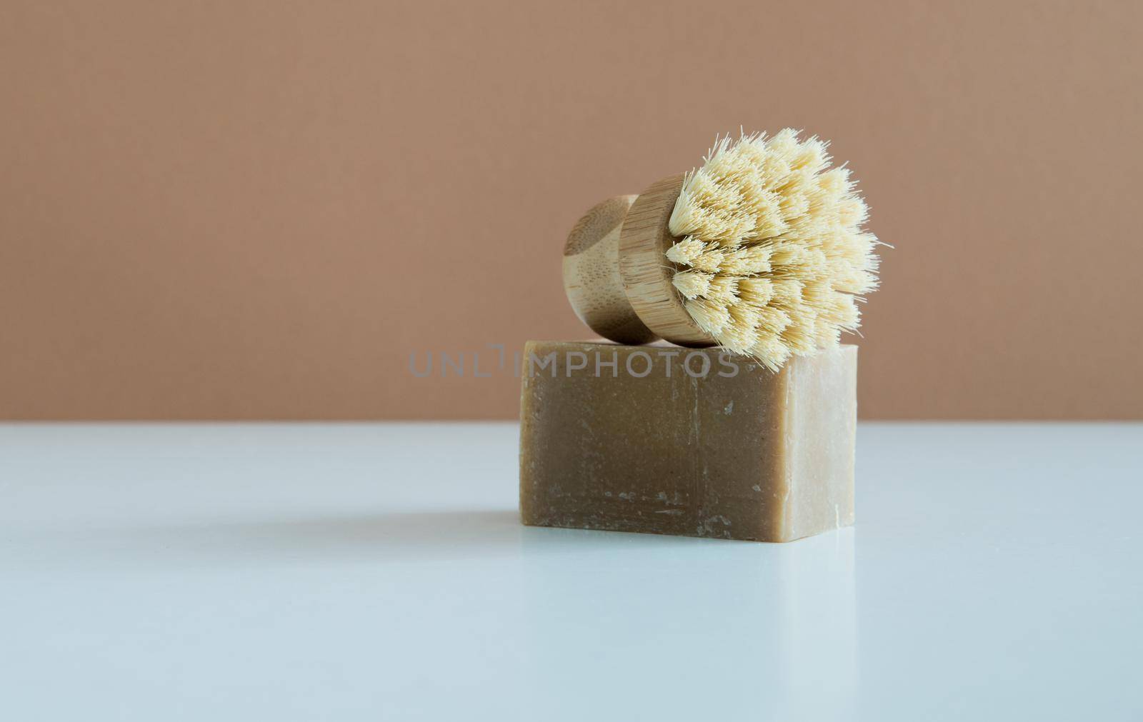 zero waste bamboo brush with soap for dishwashing . High quality photo