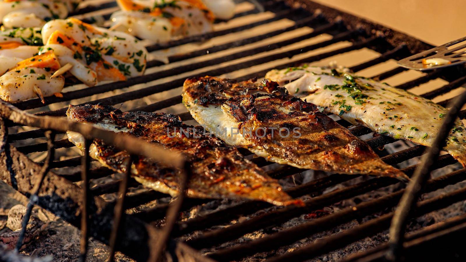 Tasty Grilled sole food detail with smoke by pippocarlot