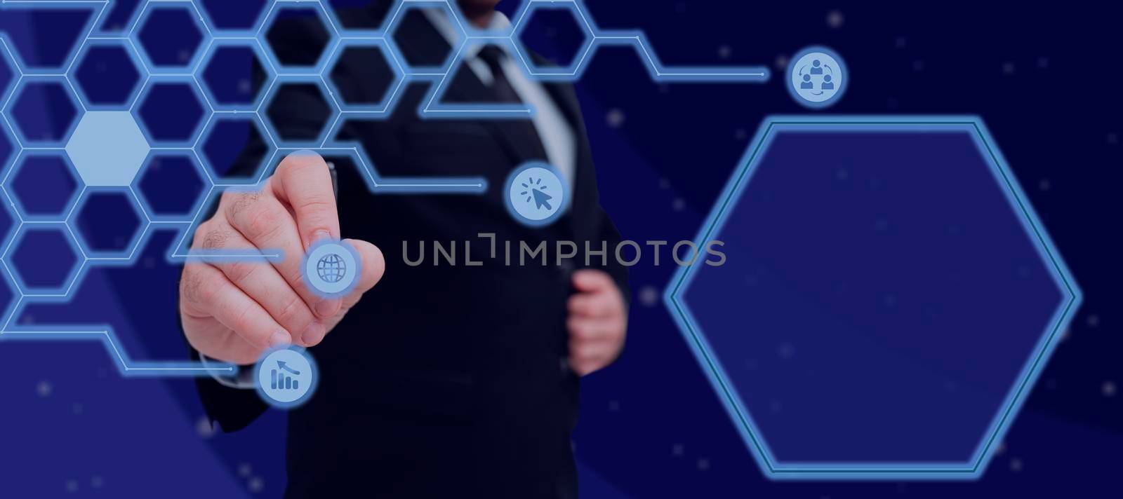 Businessman With A Pen And Pointing On Digital Symbols In A Glowing Hexagon Pattern. Man In A Suit Displaying Crucial Digital Information And Wireless Technology. by nialowwa