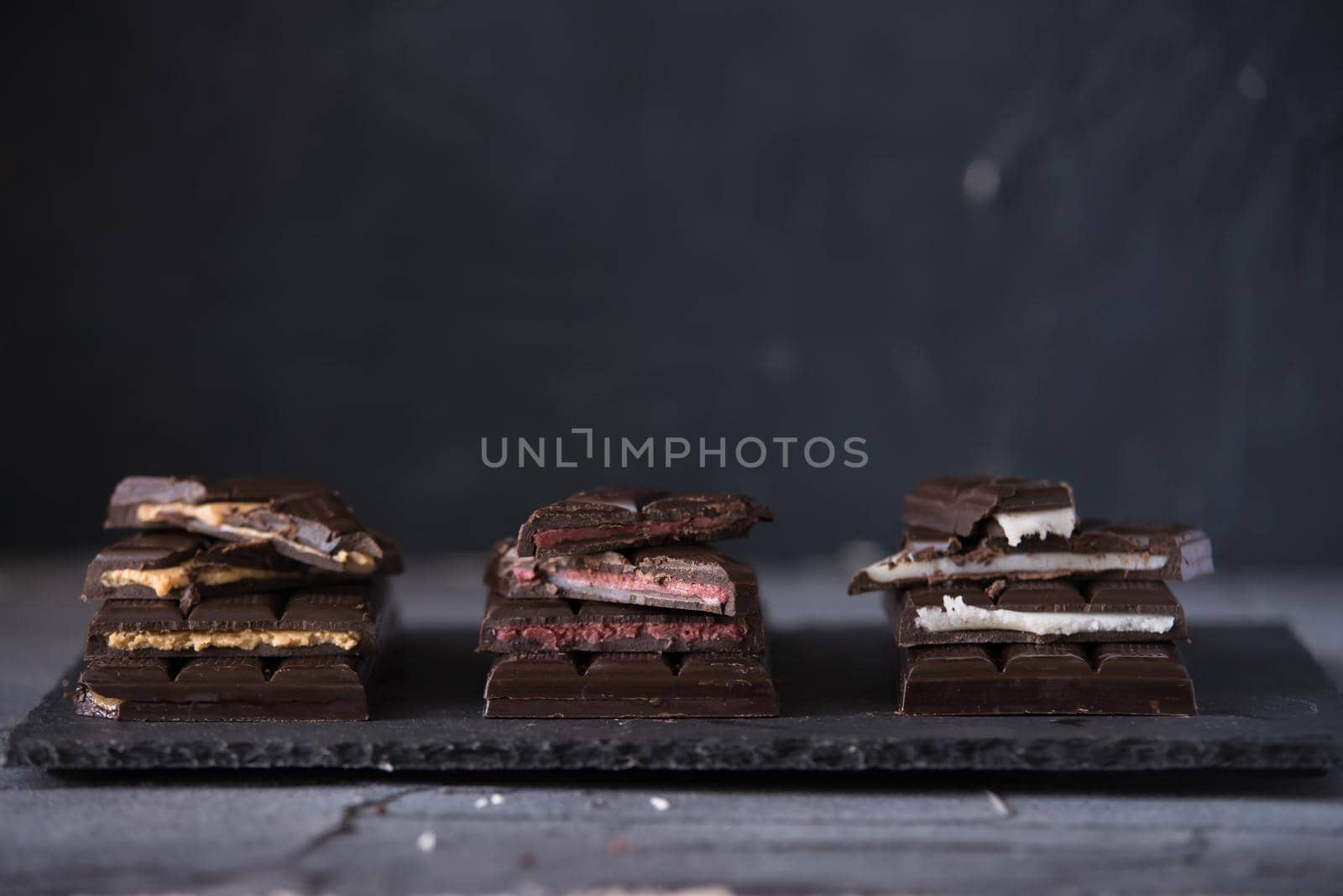 variety of homemade chocolate with different fillings. dark food photo