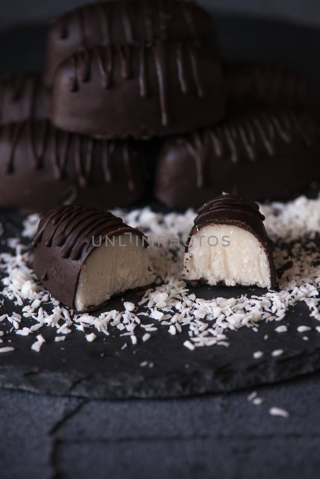 chocolate homemade bounty with coconut fillings.dark food photo