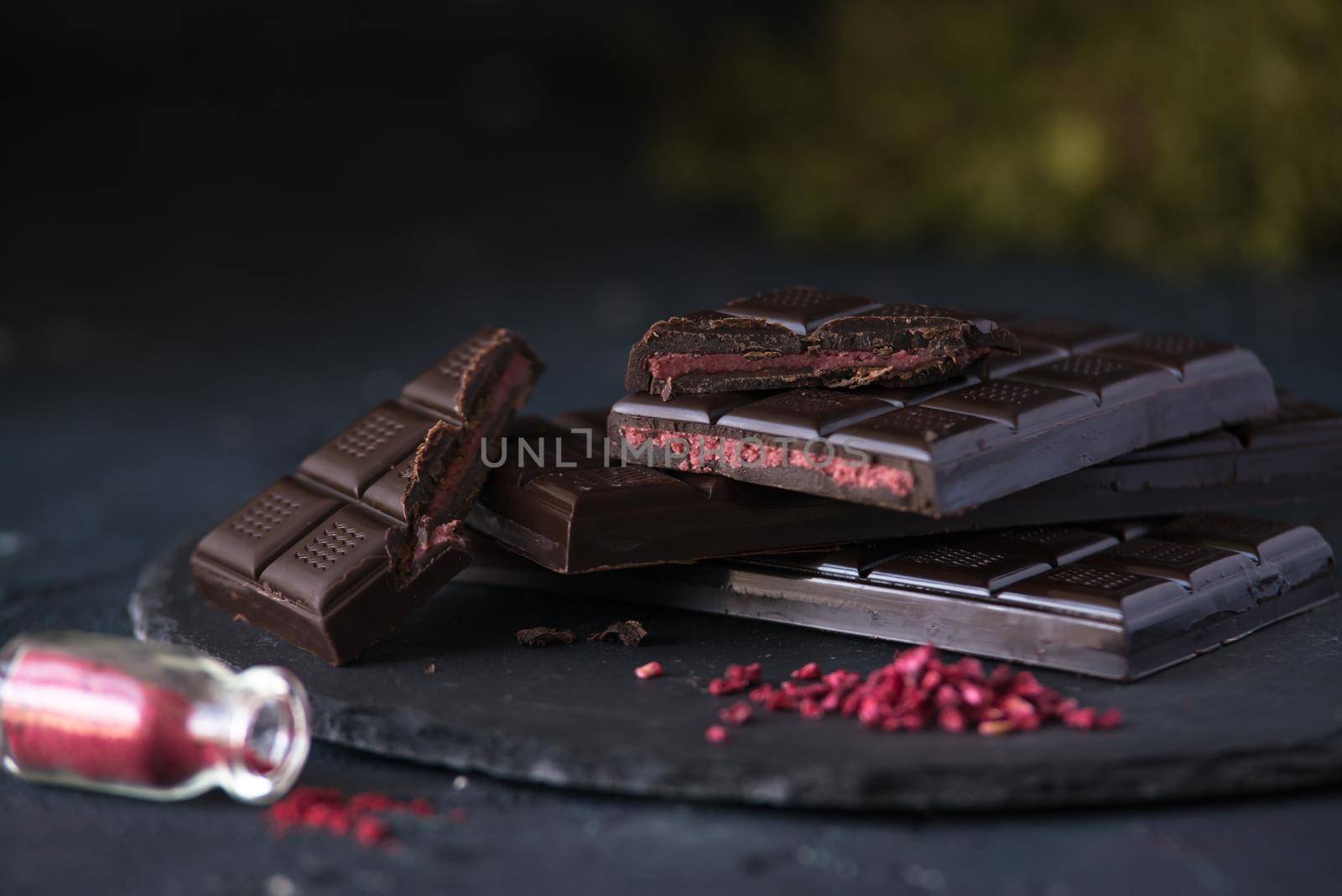 dark homemade chocolate with raspberry filling by maramorosz