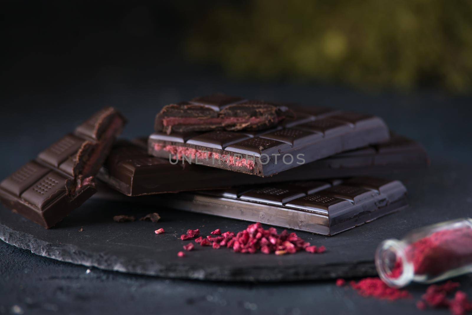 dark homemade chocolate with raspberry filling. dark mood photo