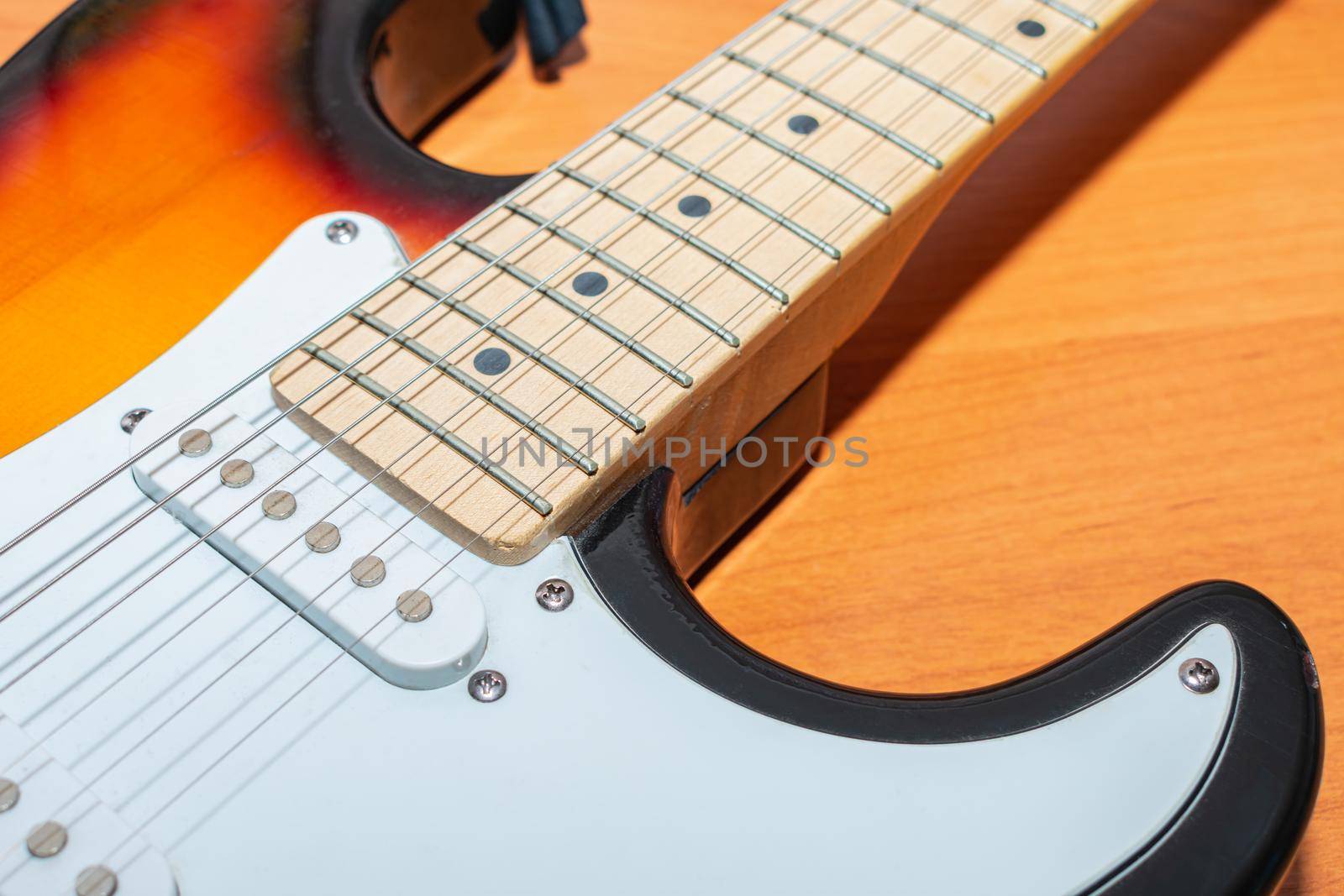 Electric guitar close-up, string body and fretboard