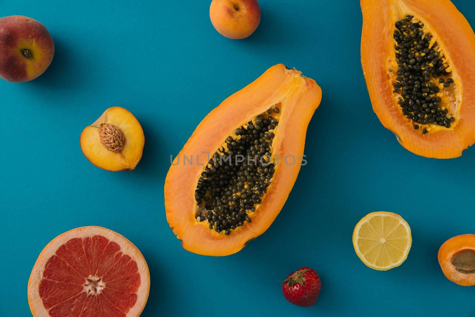 tropical summer fruits on blue background. creative arrangement